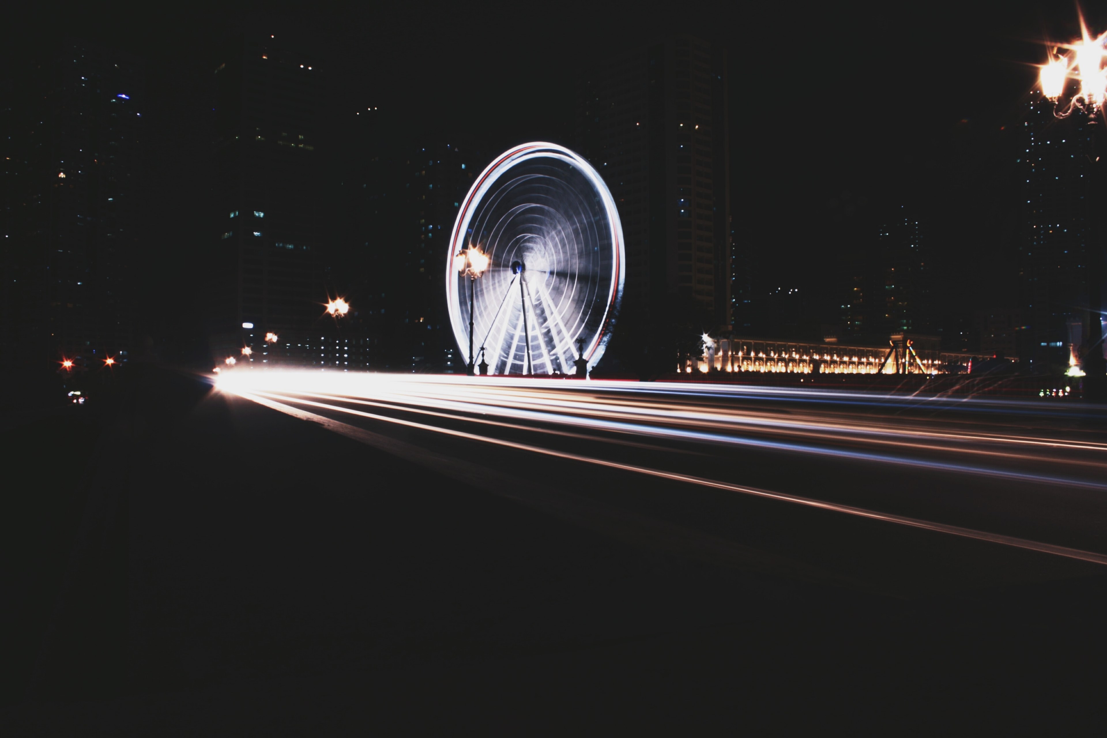 long exposure photo of ferris wheel and traffic lights in downtown area, spinning light 4k, HD Wallpaper