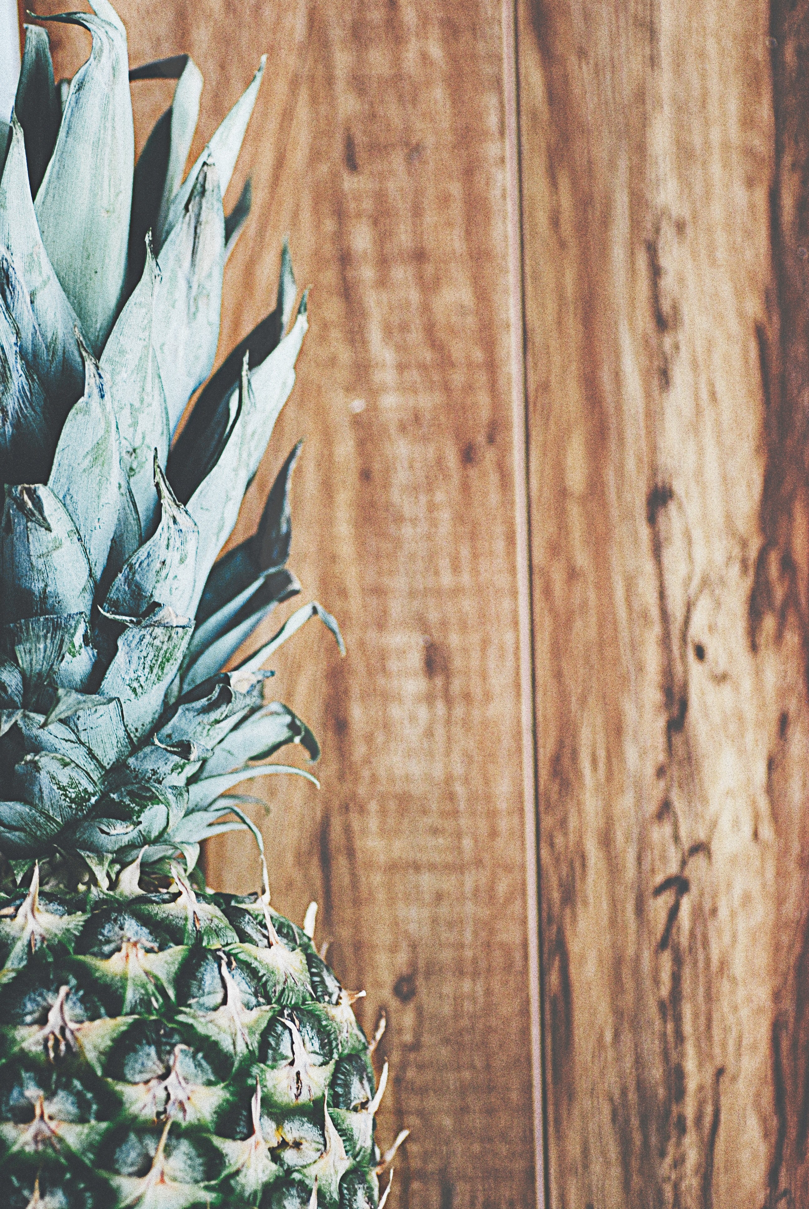 cropped shot of half of a pineapple against a wooden background, _partial pineapple 4k, Phone HD Wallpaper