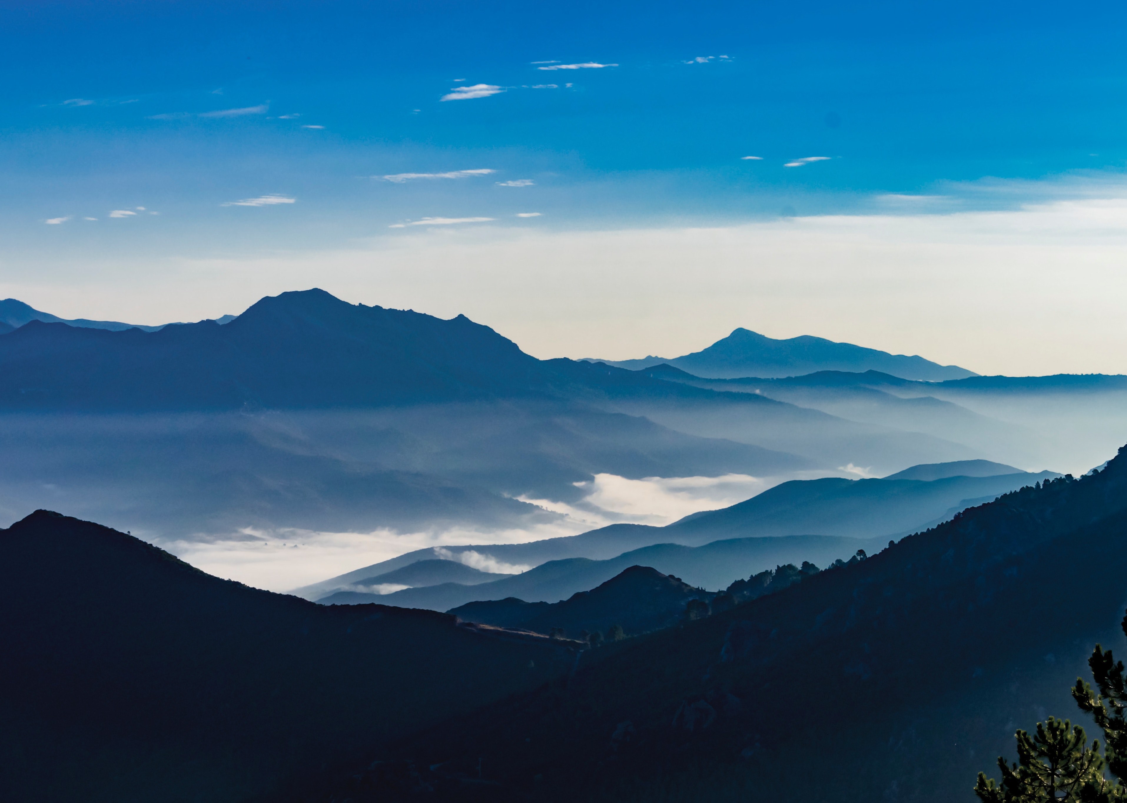 a blue shaded shot of a mountain valley in vivario, when the sunrise the light is magic 4k, HD Wallpaper