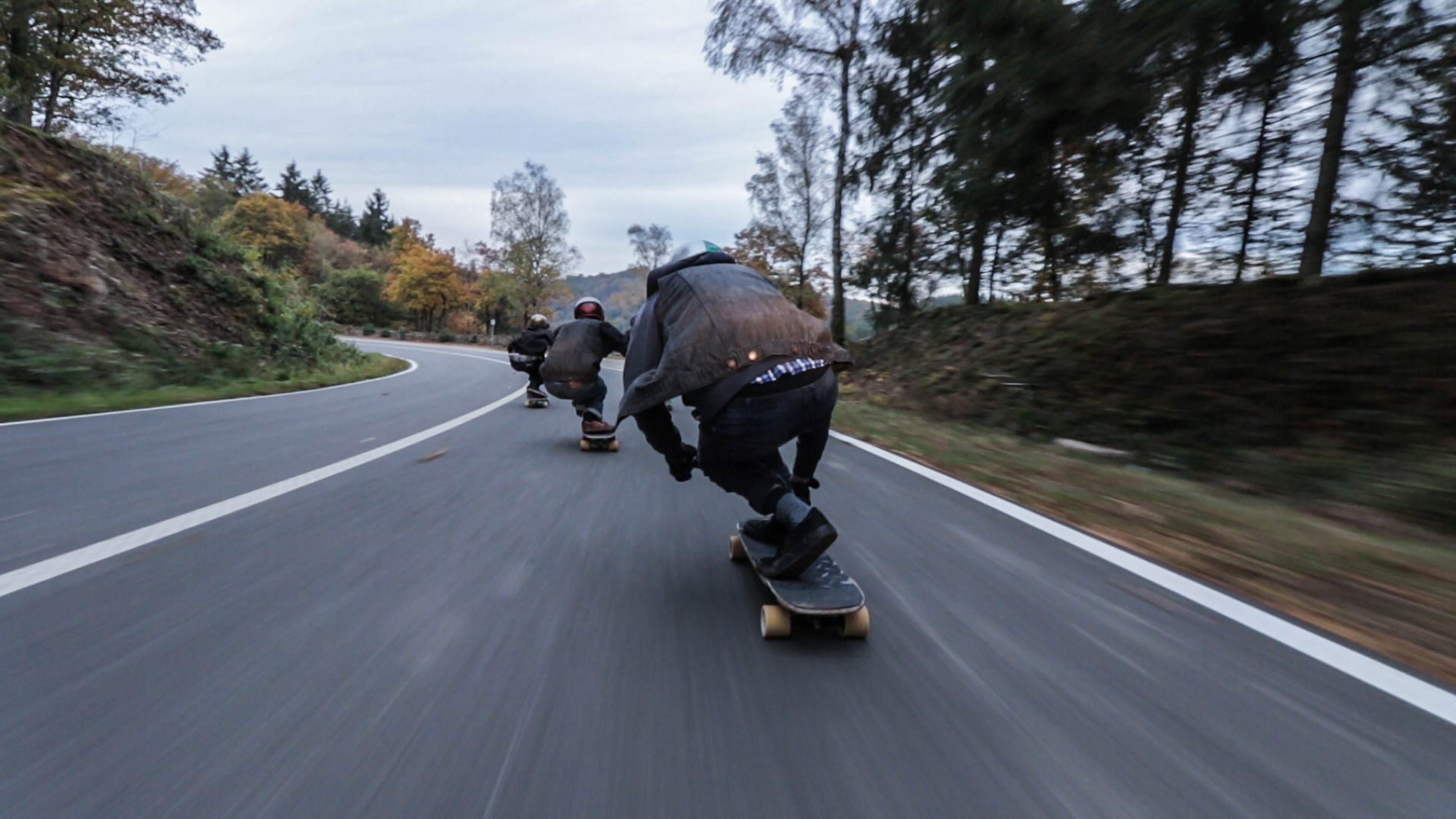 three skateboarders speeding on an asphalt road, racing skaters 4k, HD Wallpaper