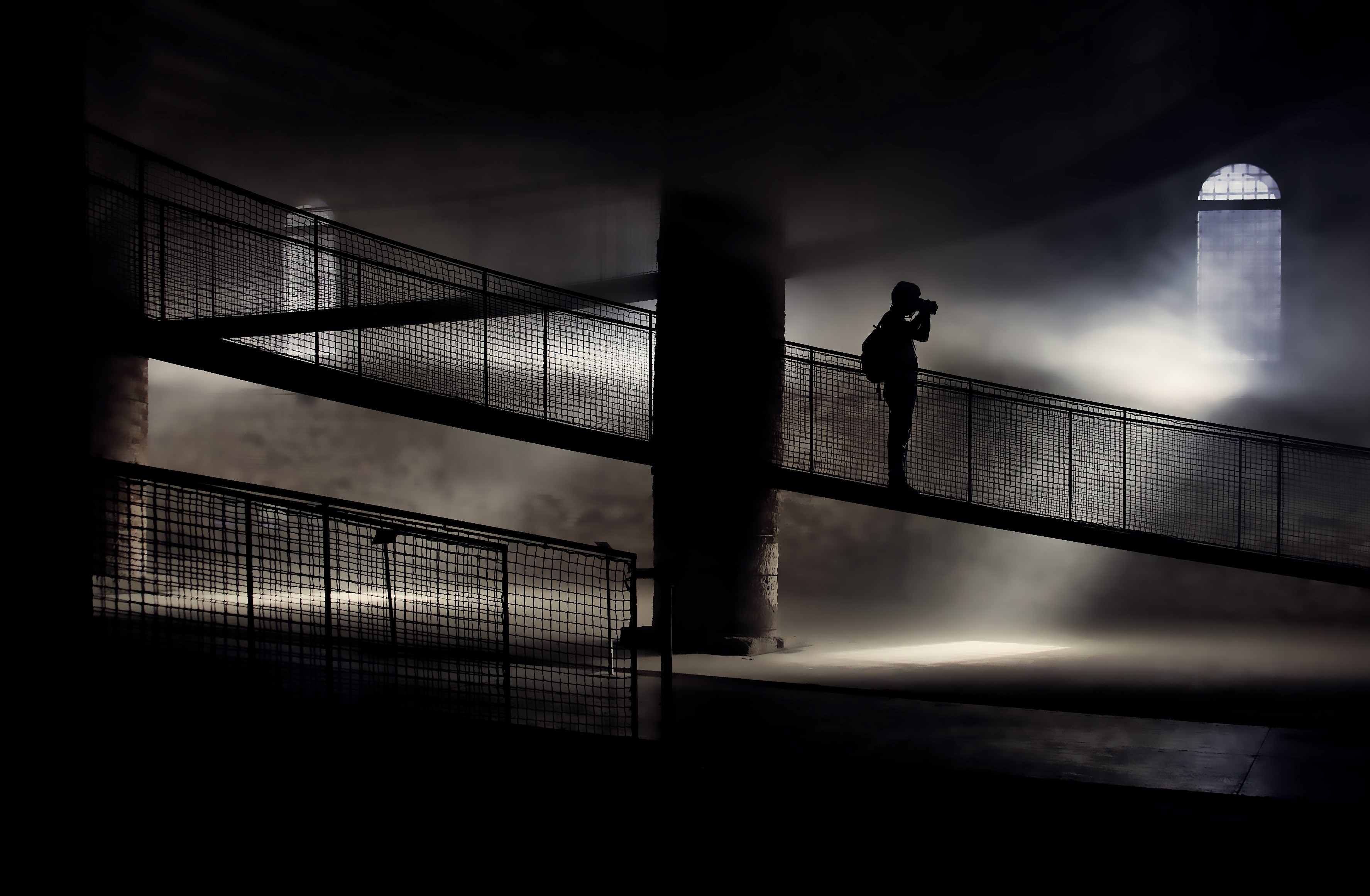 a silhouette of a photographer on a dark staircase in an old building, the photographer in the fog 4k, HD Wallpaper