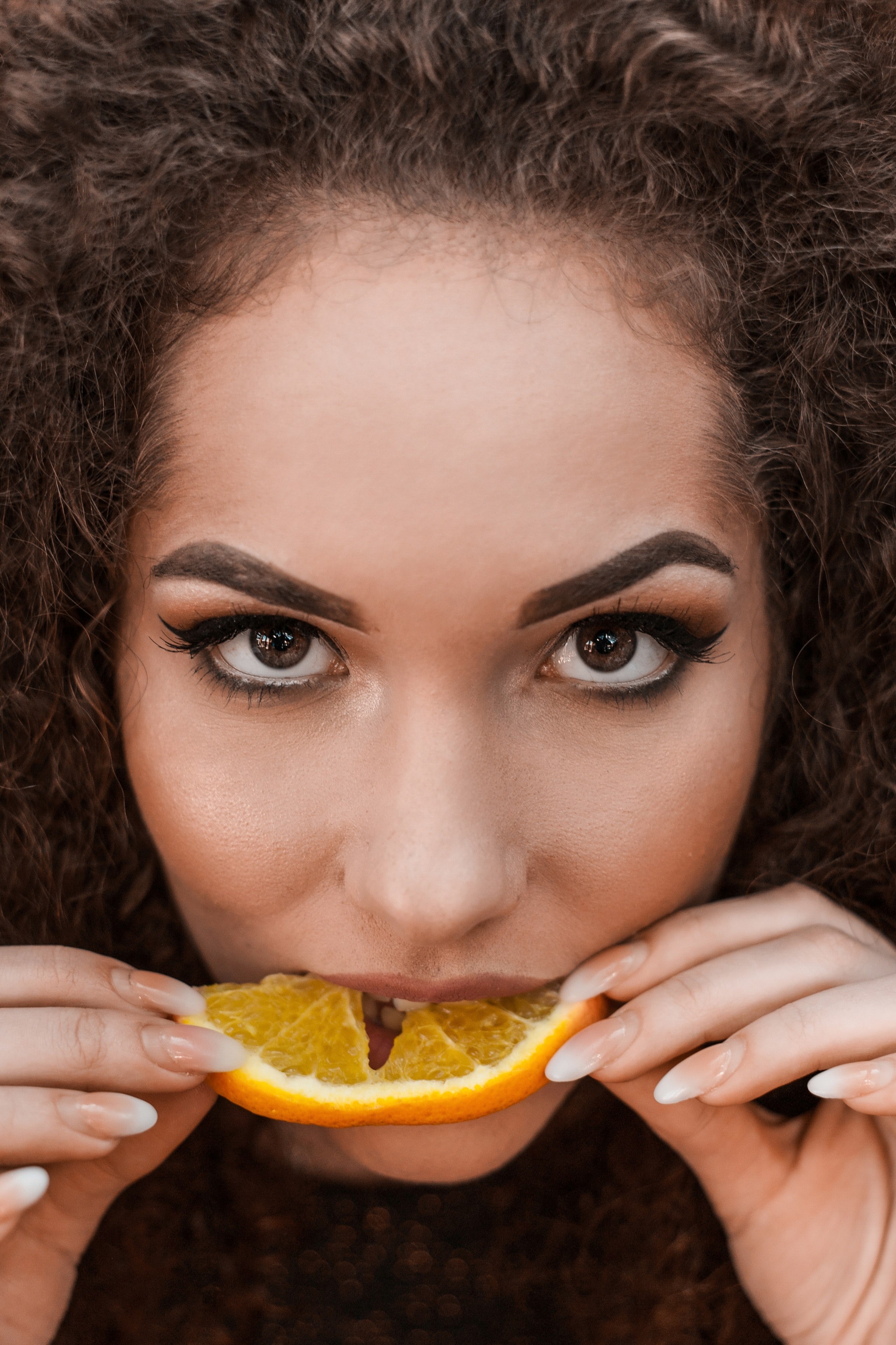 curly girl eating orange 4k, Phone HD Wallpaper