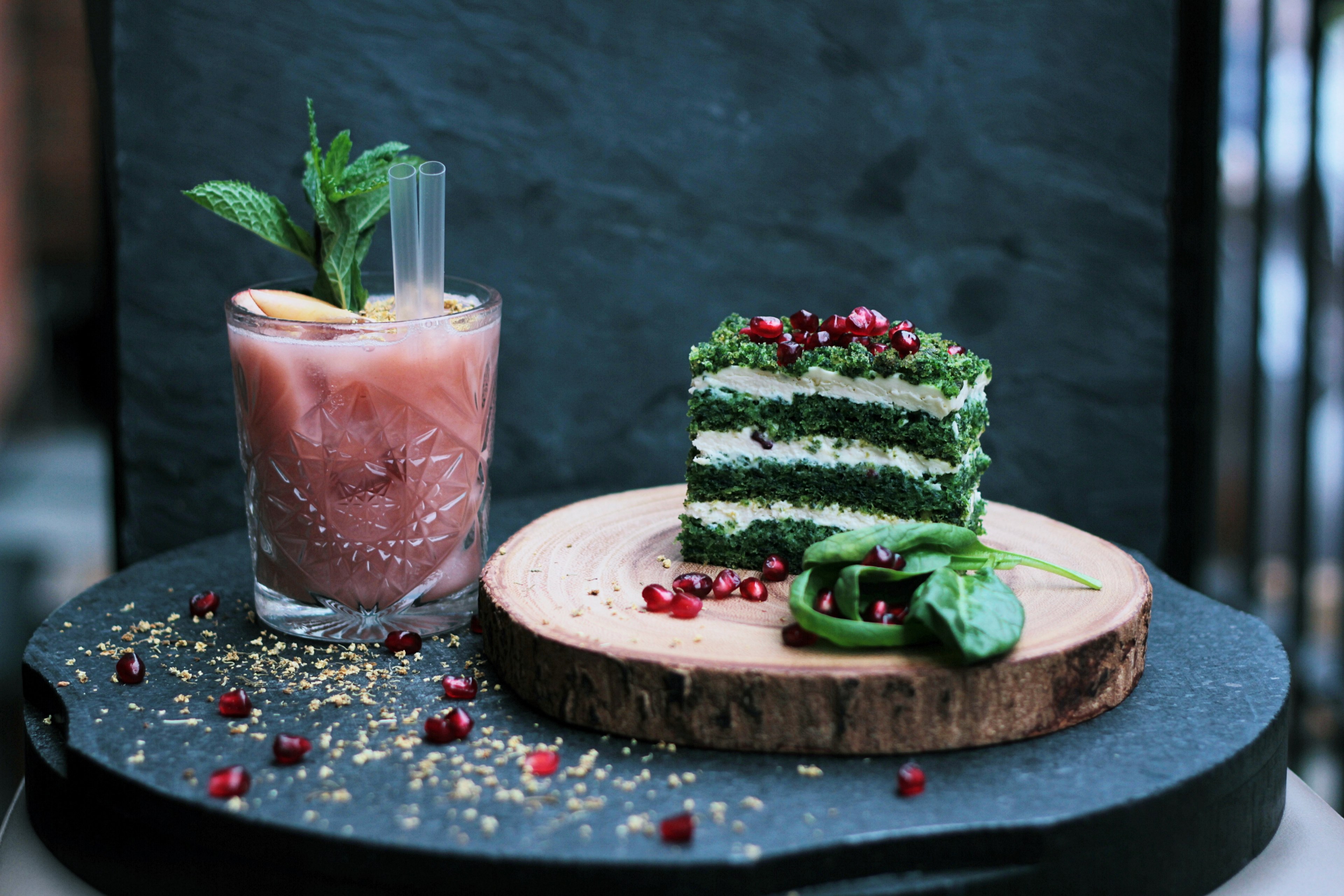 layered stack of herbs cheese and pomegranate seeds with a fruity drink, green herb cake 4k, HD Wallpaper