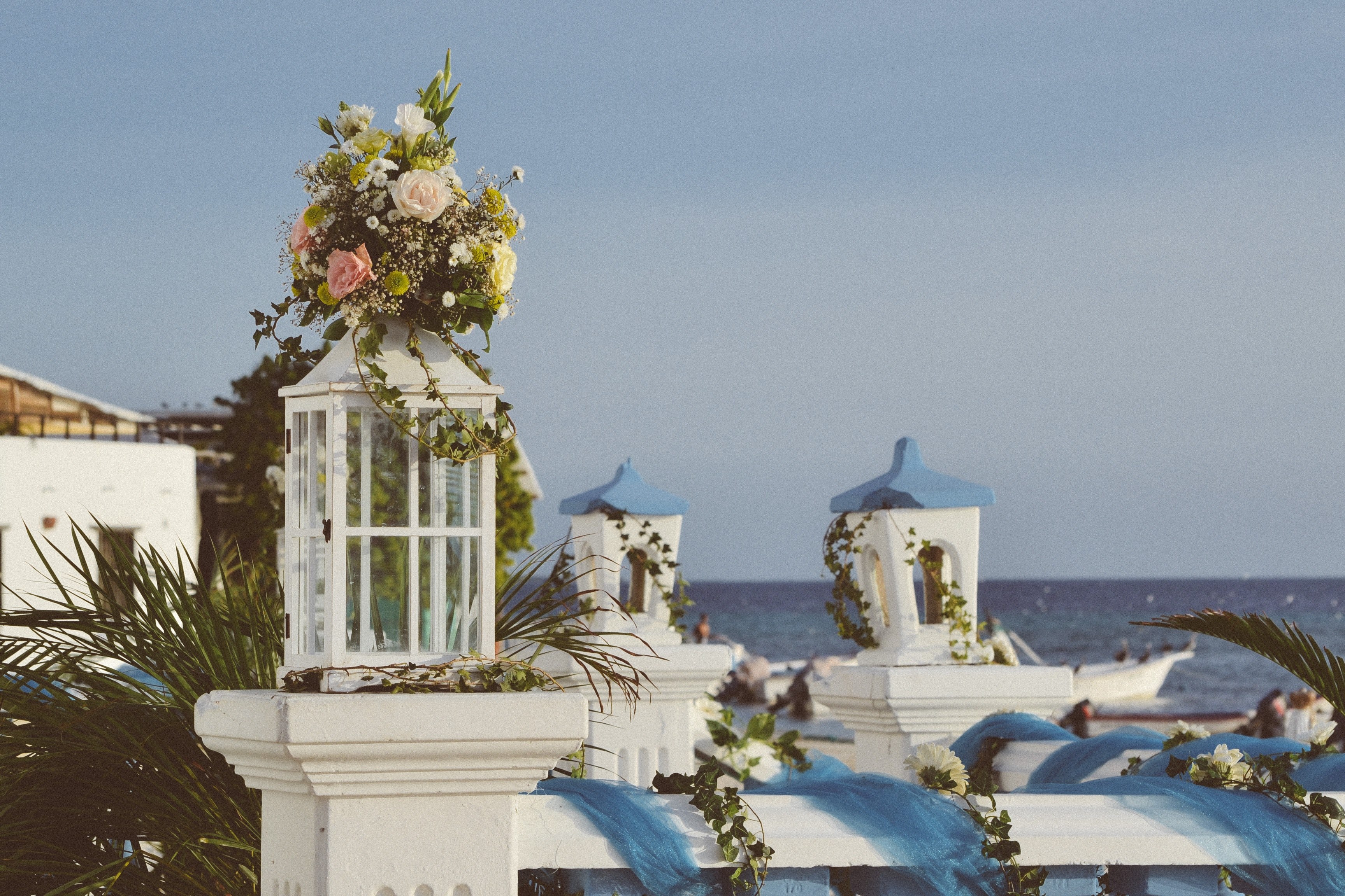 a bunch of flowers on top of a balustrade in a mediterranean setting with the sea in the background, flowers on a mediterranean balcony 4k, HD Wallpaper