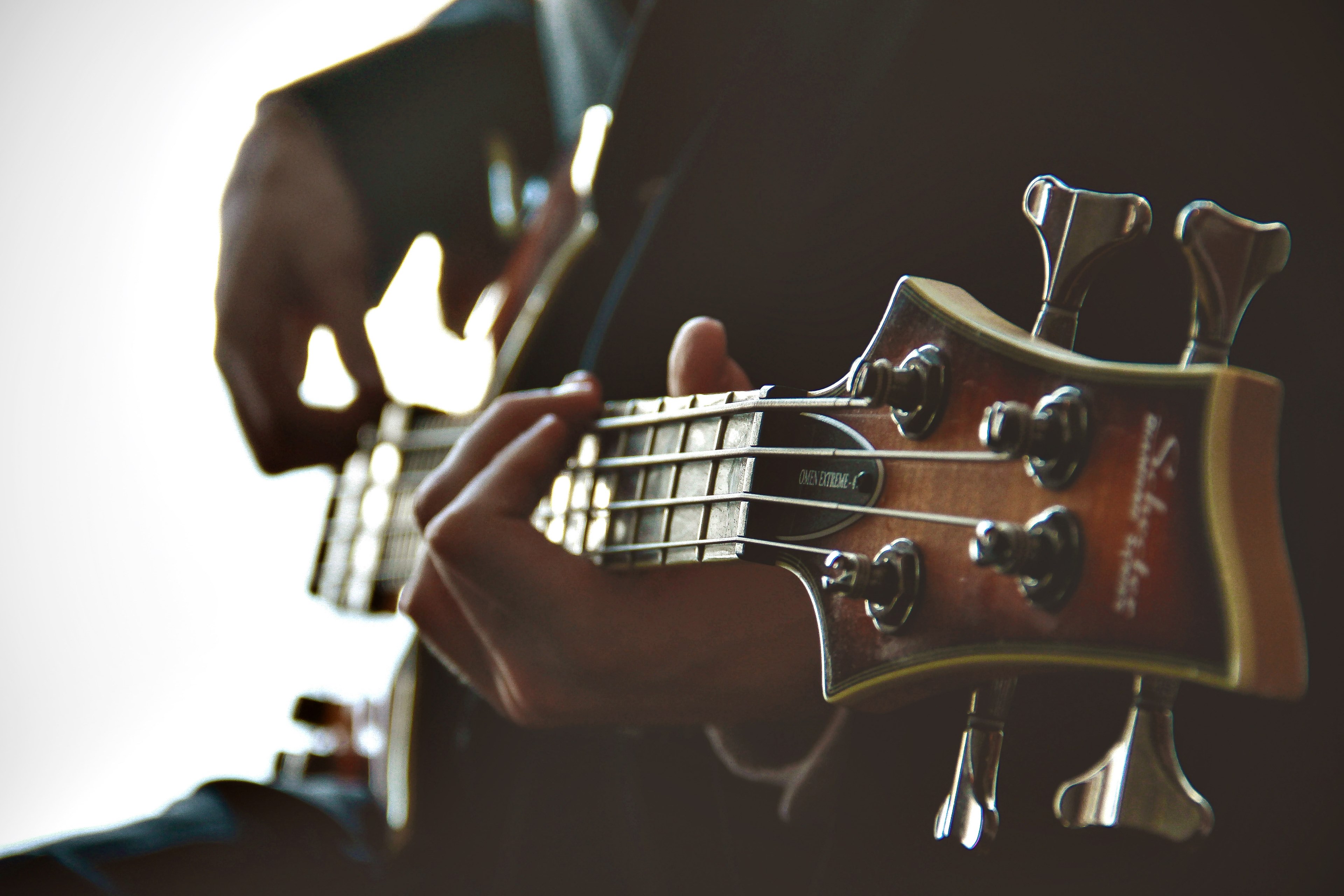 a close up of a persons hands strumming the guitar, hands on a guitar neck 4k, HD Wallpaper