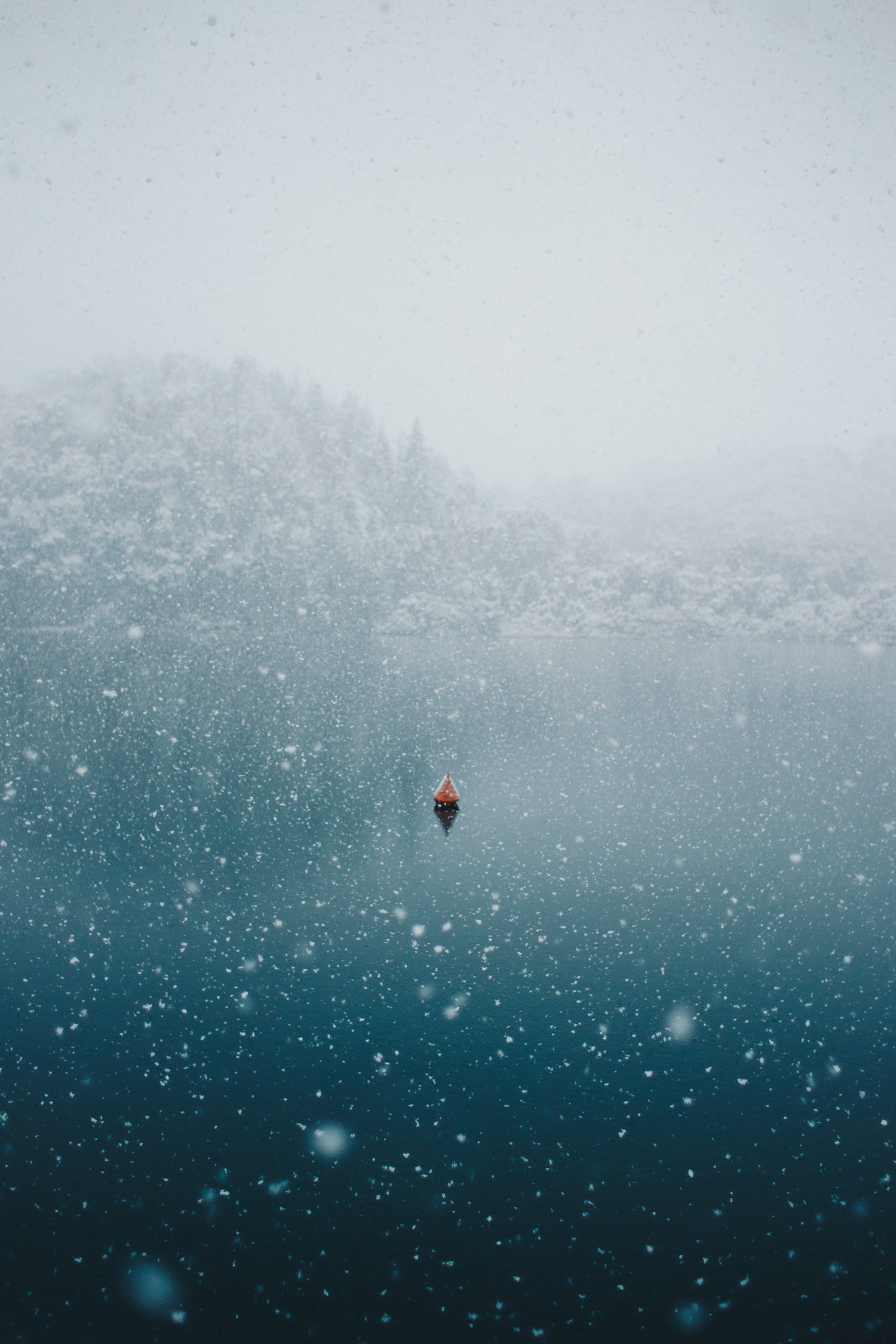 snowing over an ocean with a lone boat, _patagonian lake buoy 4k, Phone HD Wallpaper