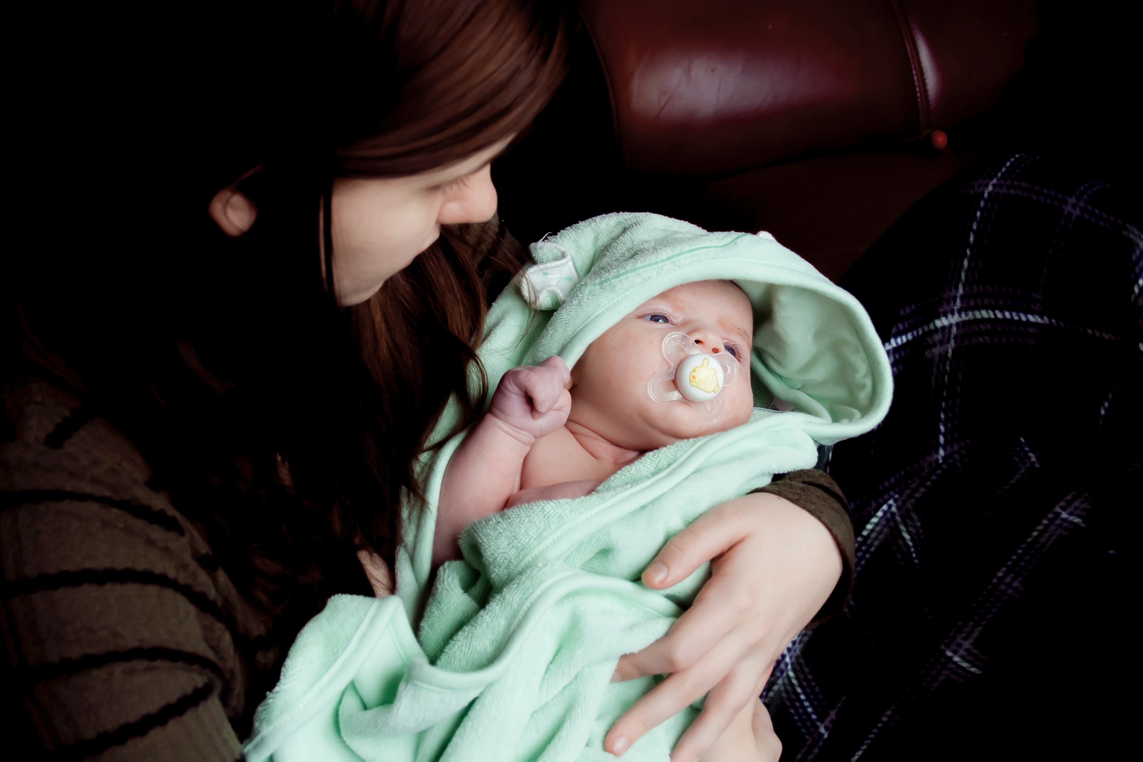 infant lying in a teal blanket being cradled by a woman with reddish brown hair, my jewels 4k, HD Wallpaper