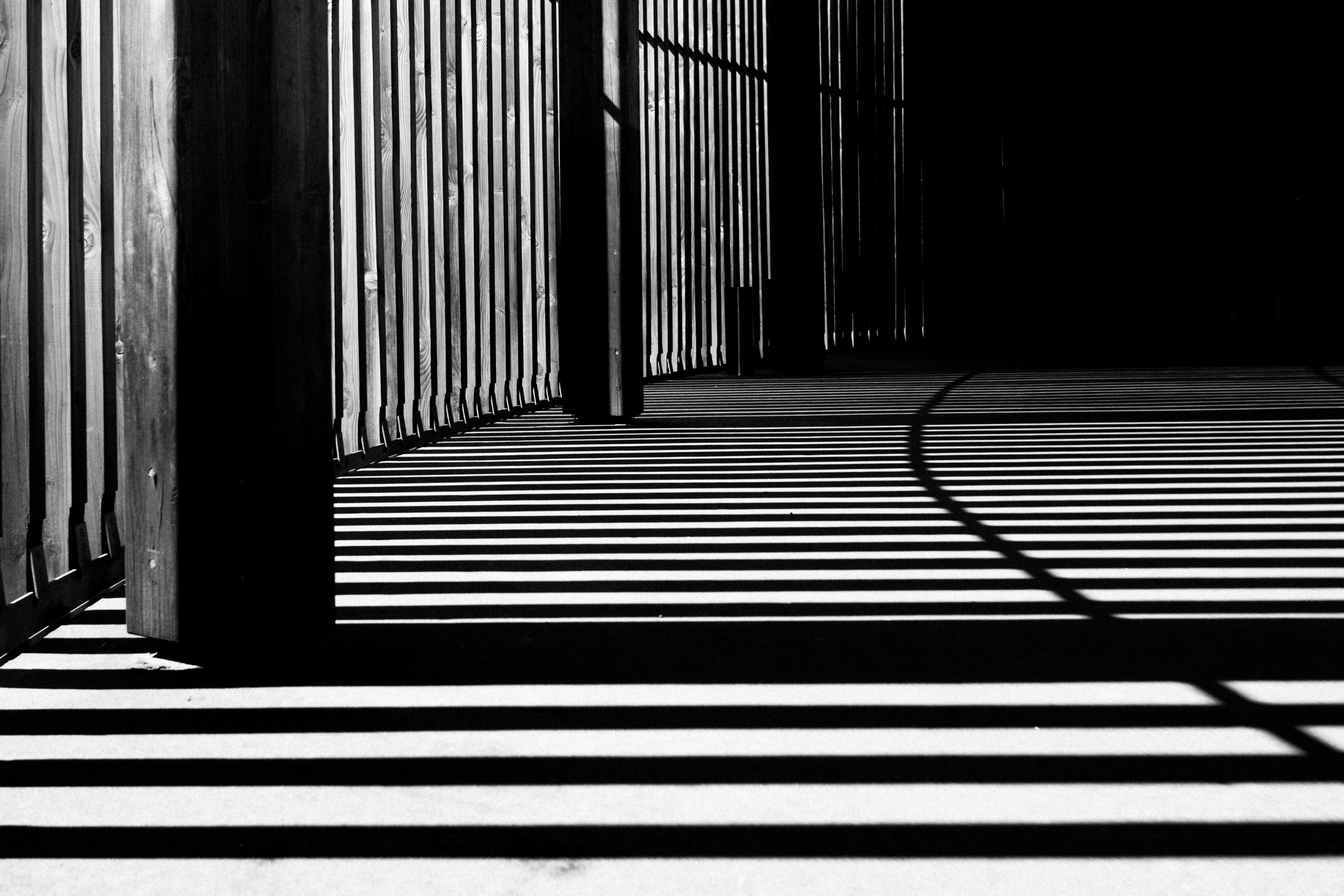 the shadows from a building structure creating lines across the floor, shadow play 4k, HD Wallpaper