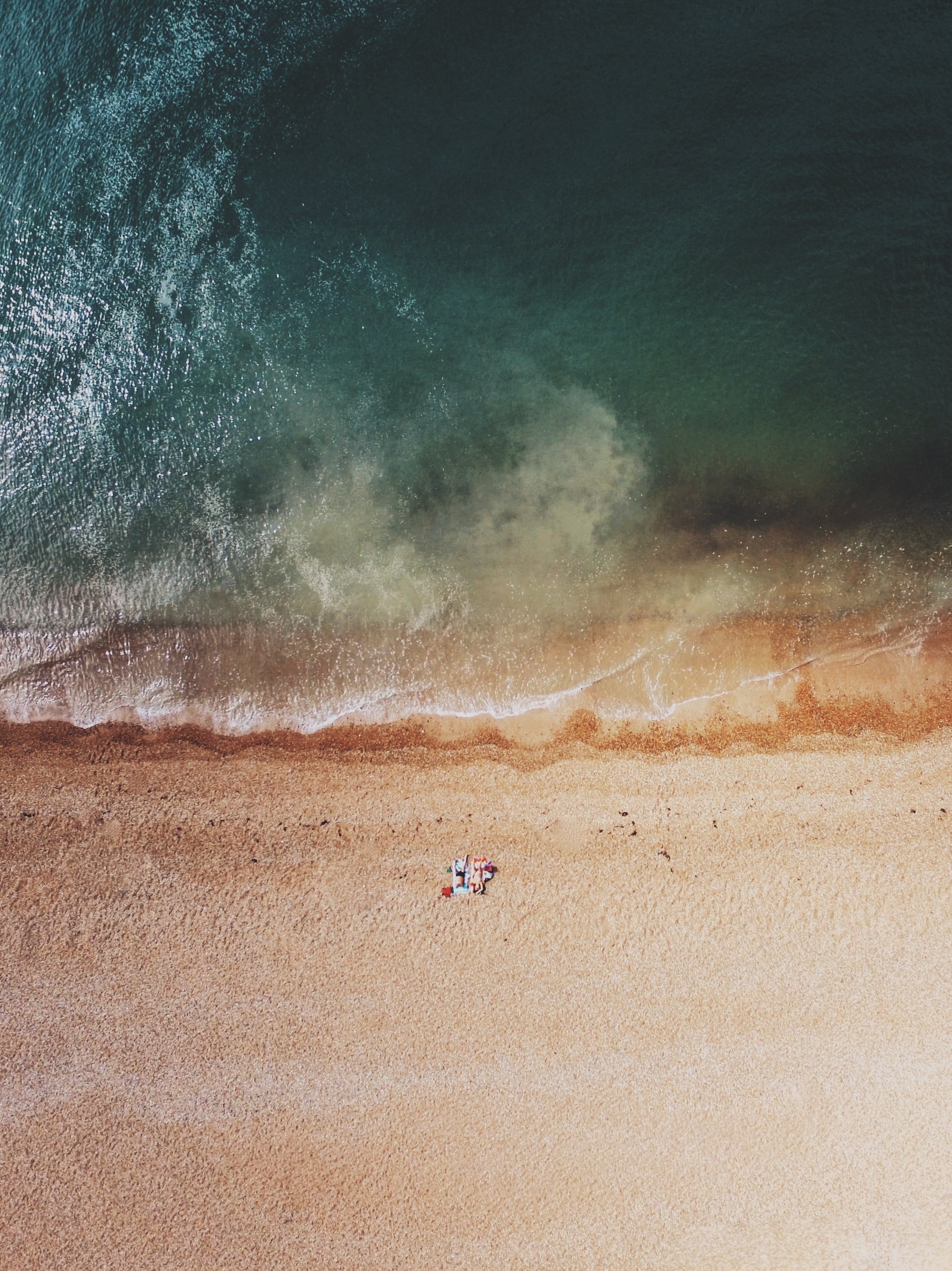 two people lie close to each other on a golden beach in brighton, alone together 4k, Phone HD Wallpaper