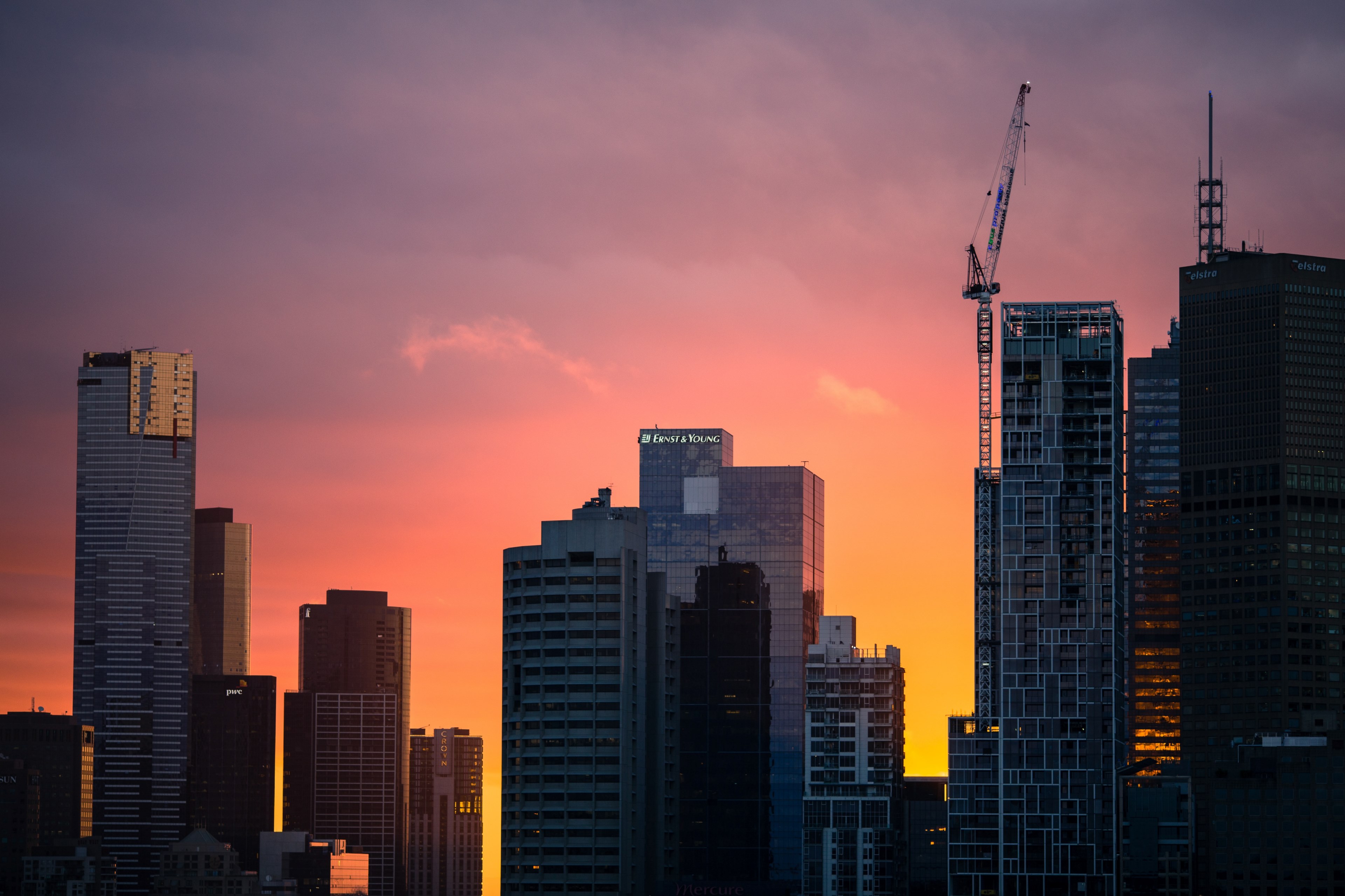 a pink and orange sunset behind the skyscrapers of melbourne, melbourne skyline at sunset 4k, HD Wallpaper