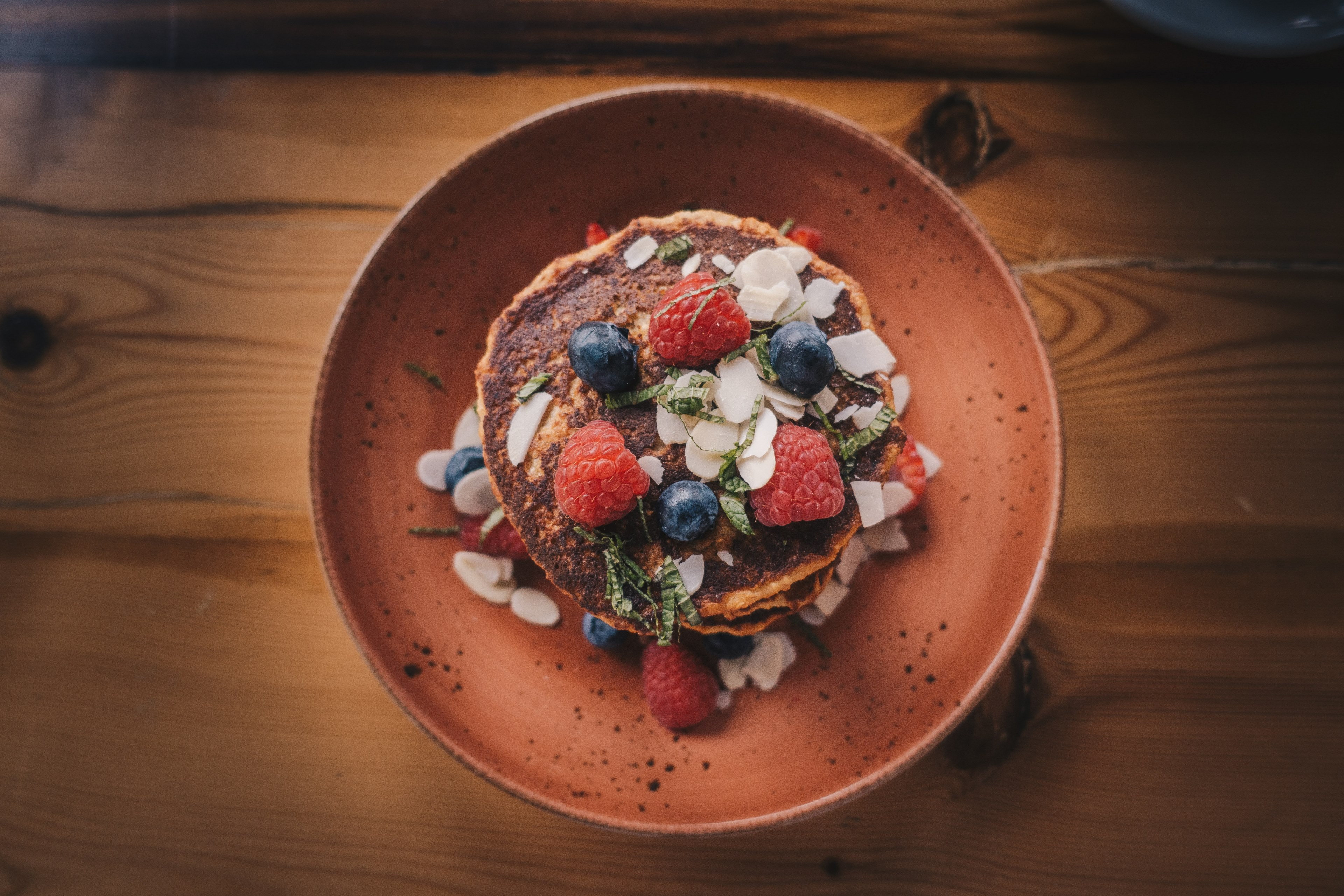 pancakes on an orange dish served with blueberries and raspberries, pancakes 4k, HD Wallpaper