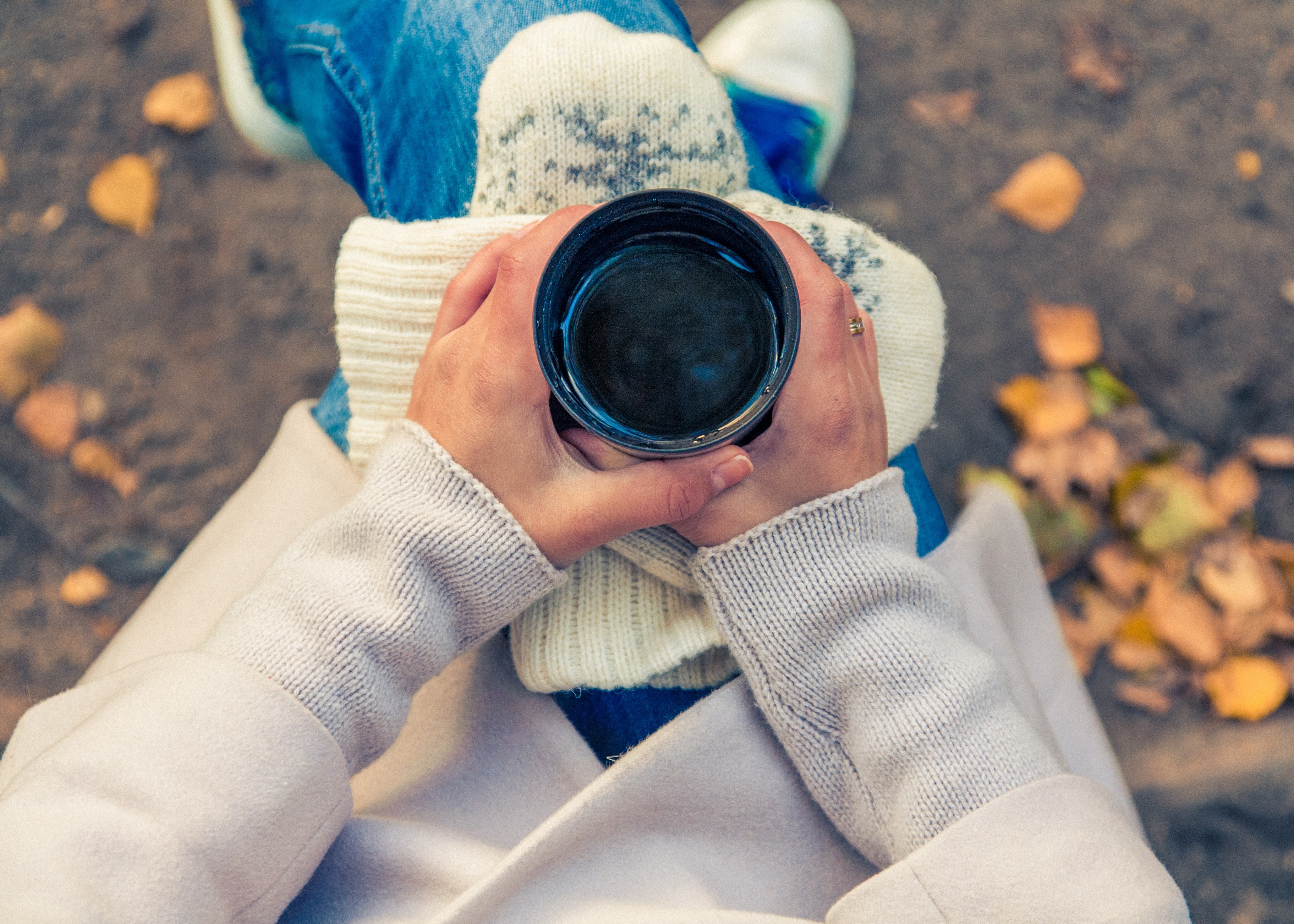 person holds a cup of coffee and mitten on their lap, coffee in autumn 4k, HD Wallpaper