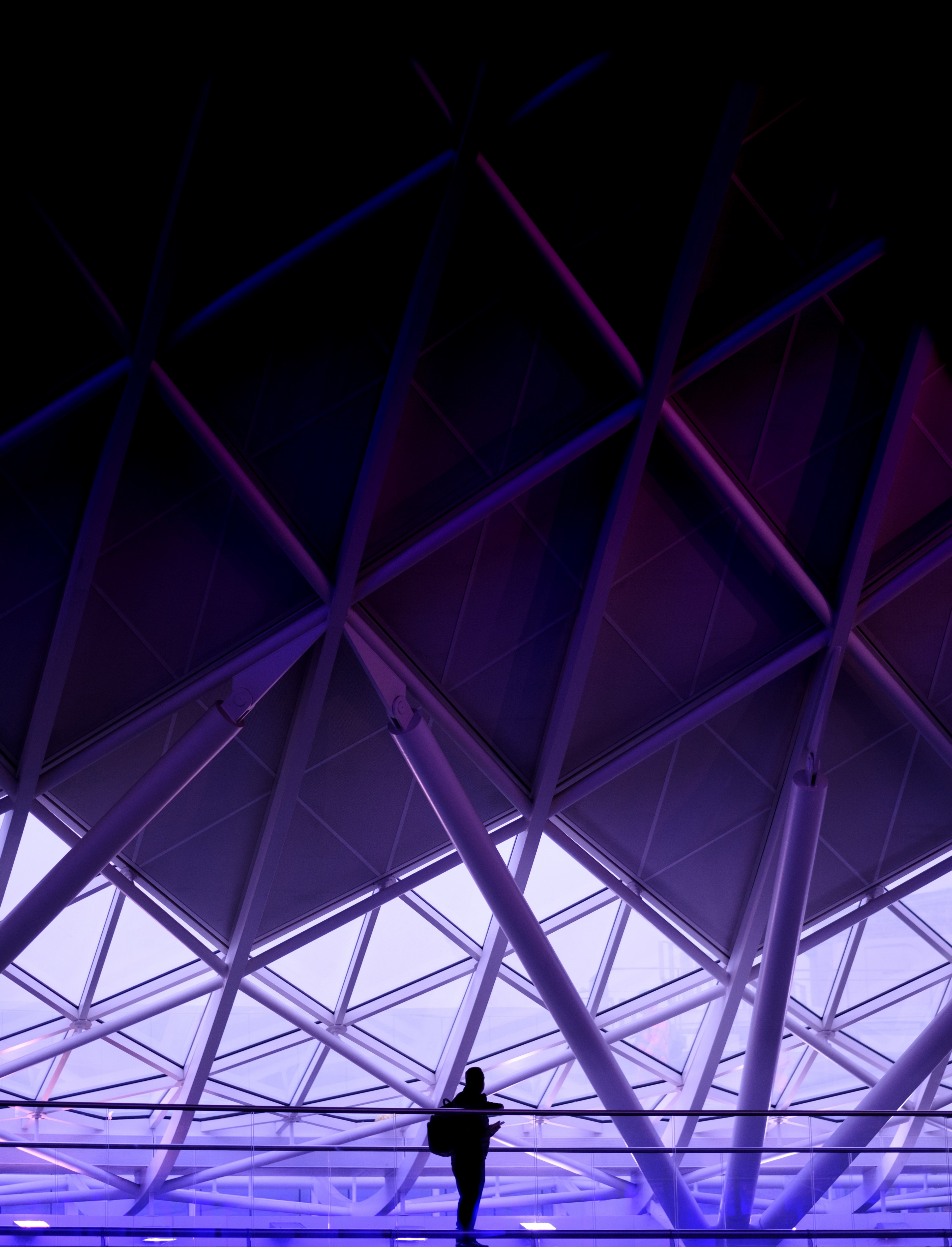 a silhouette of a person against the backdrop of a purple hued steel structure, purple architecture 4k, Phone HD Wallpaper