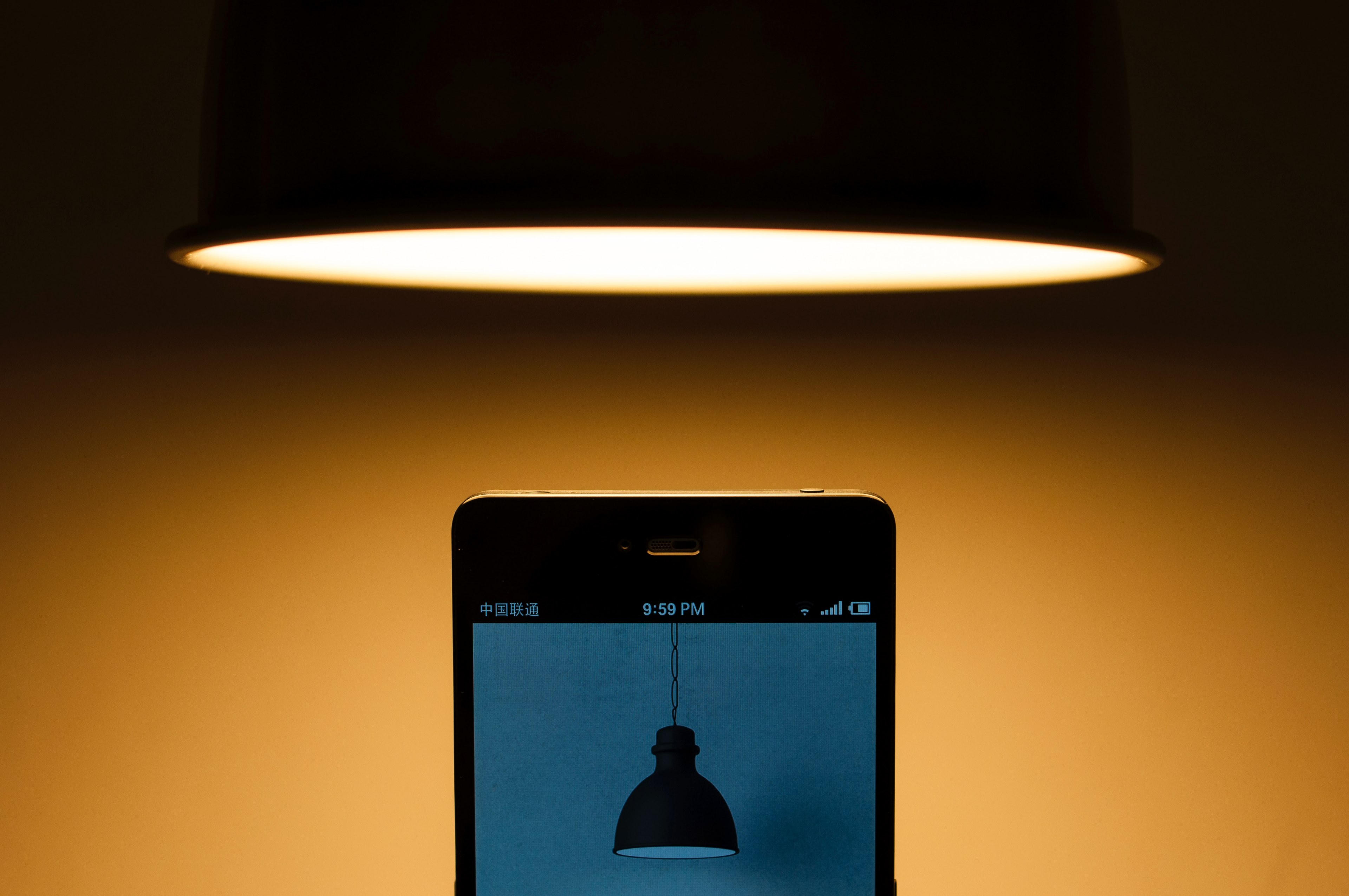 lamp hangs above cellphone that displays a photo of a lamp, lamp on phone under lamp 4k, HD Wallpaper