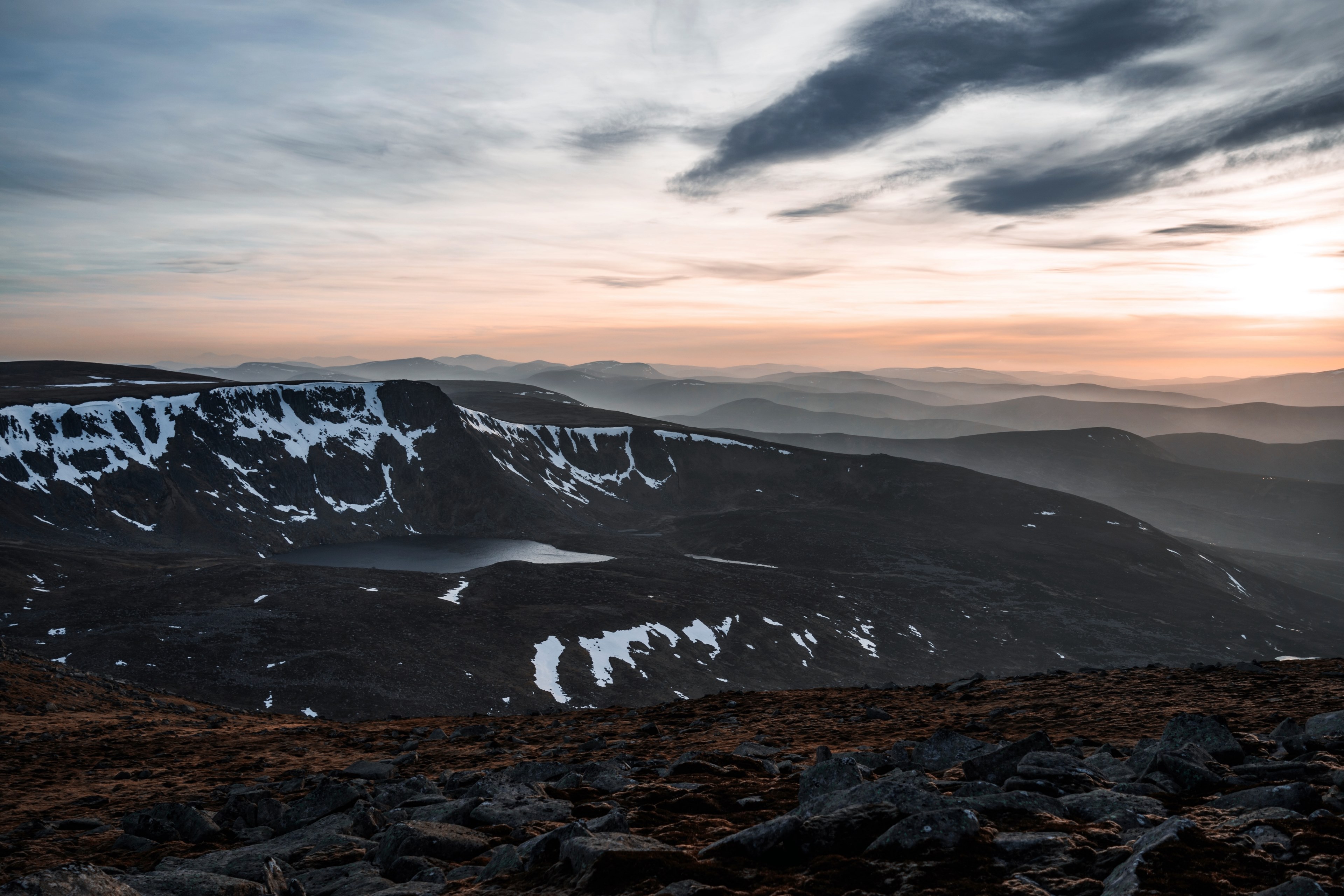 clouds swept across sky with sunset and snowy mountains in distance at lochnagar, lochnagar 4k, HD Wallpaper
