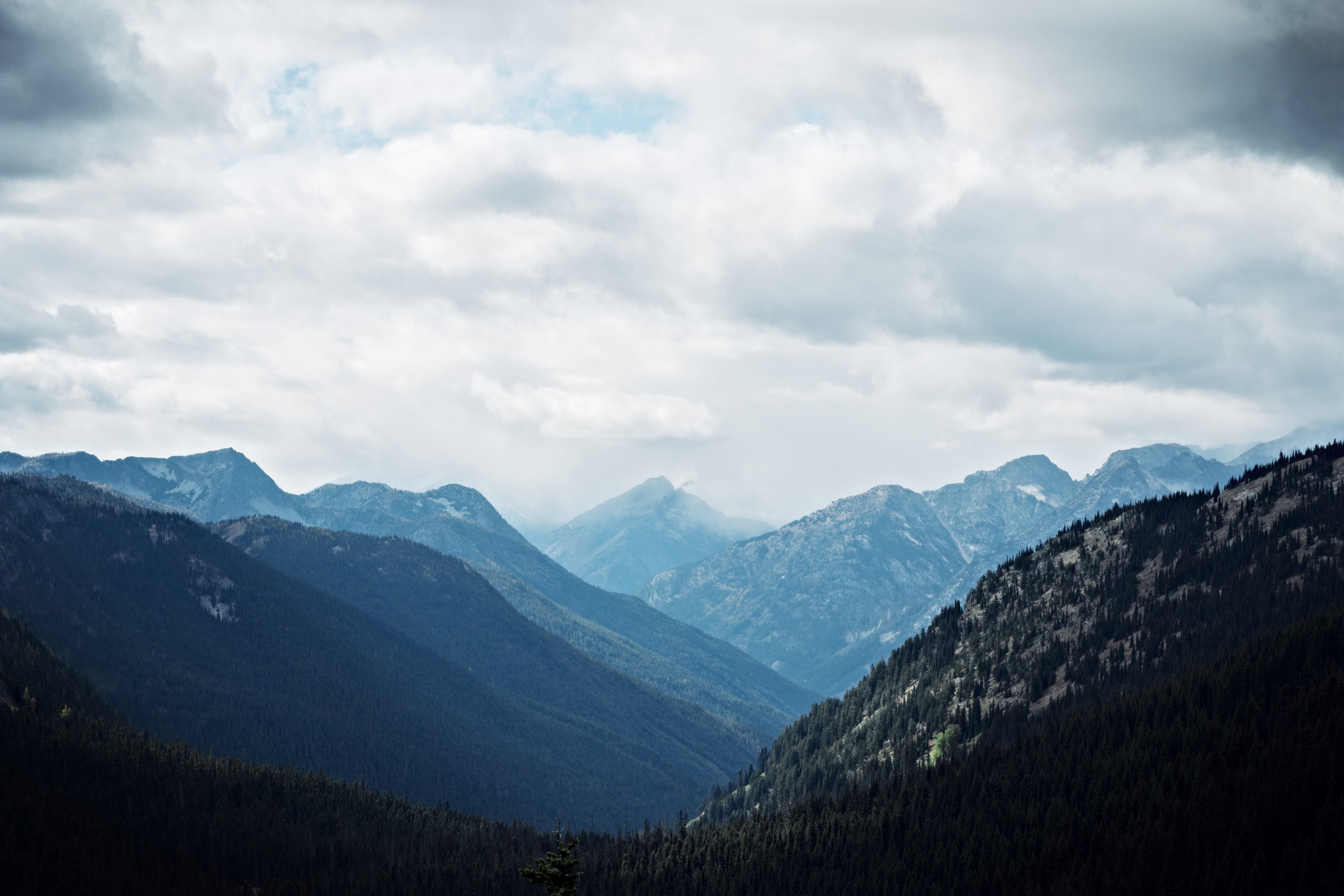 a valley in north cascades national park under overcast sky, clouds over a mountain valley 4k, HD Wallpaper