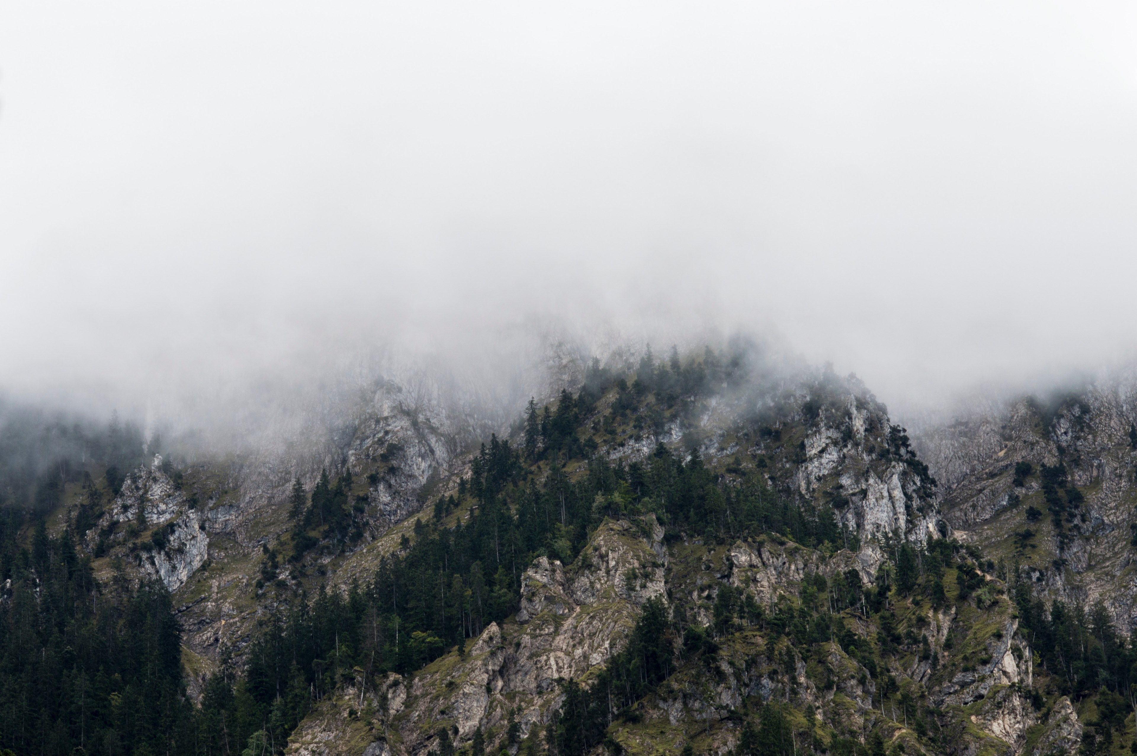 craggy ridges covered in a thick fog in tyrol, fog over mountains in tyrol 4k, HD Wallpaper