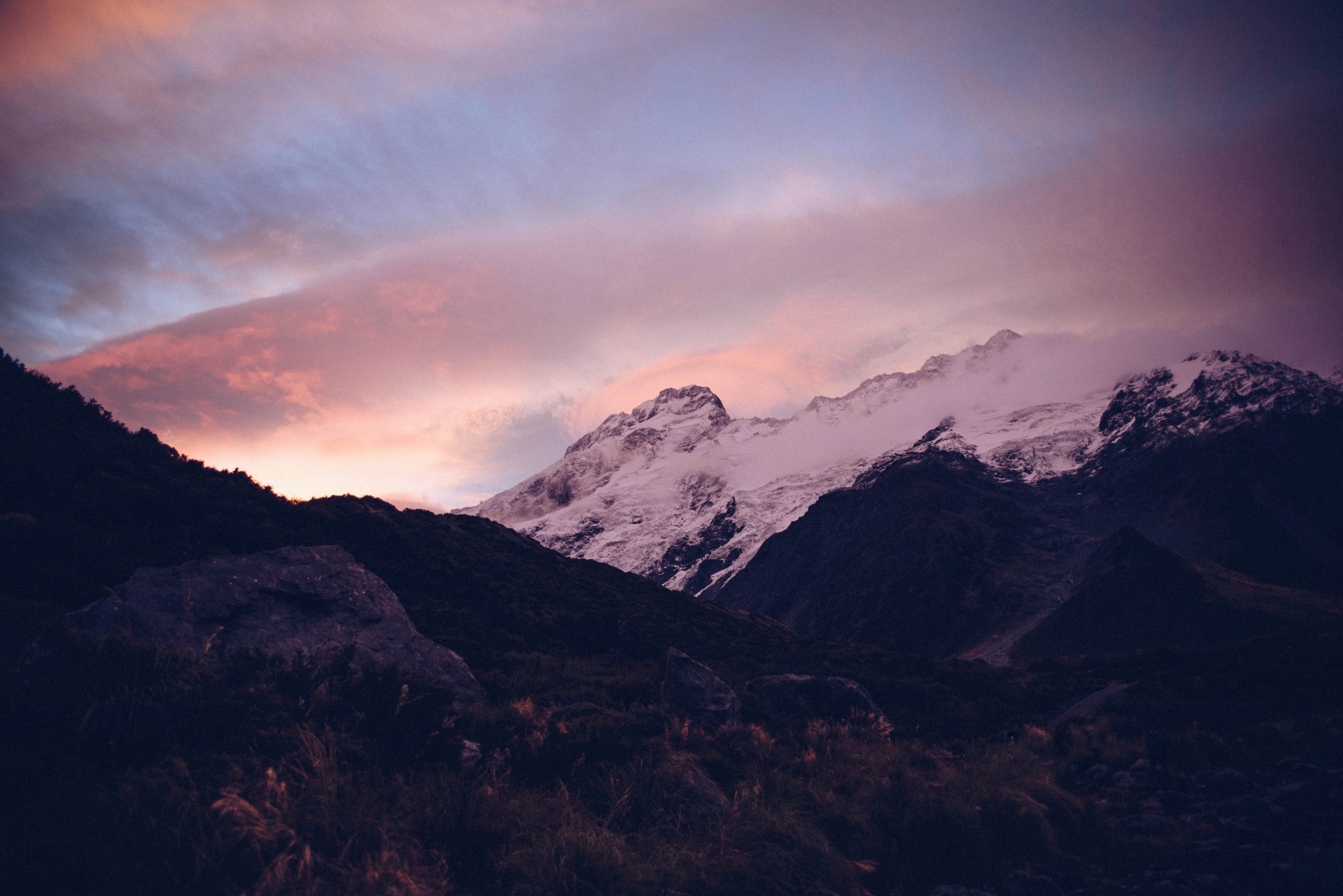 a pink hued shot of sunset over snowy mountains, pink sunset in the mountains 4k, HD Wallpaper