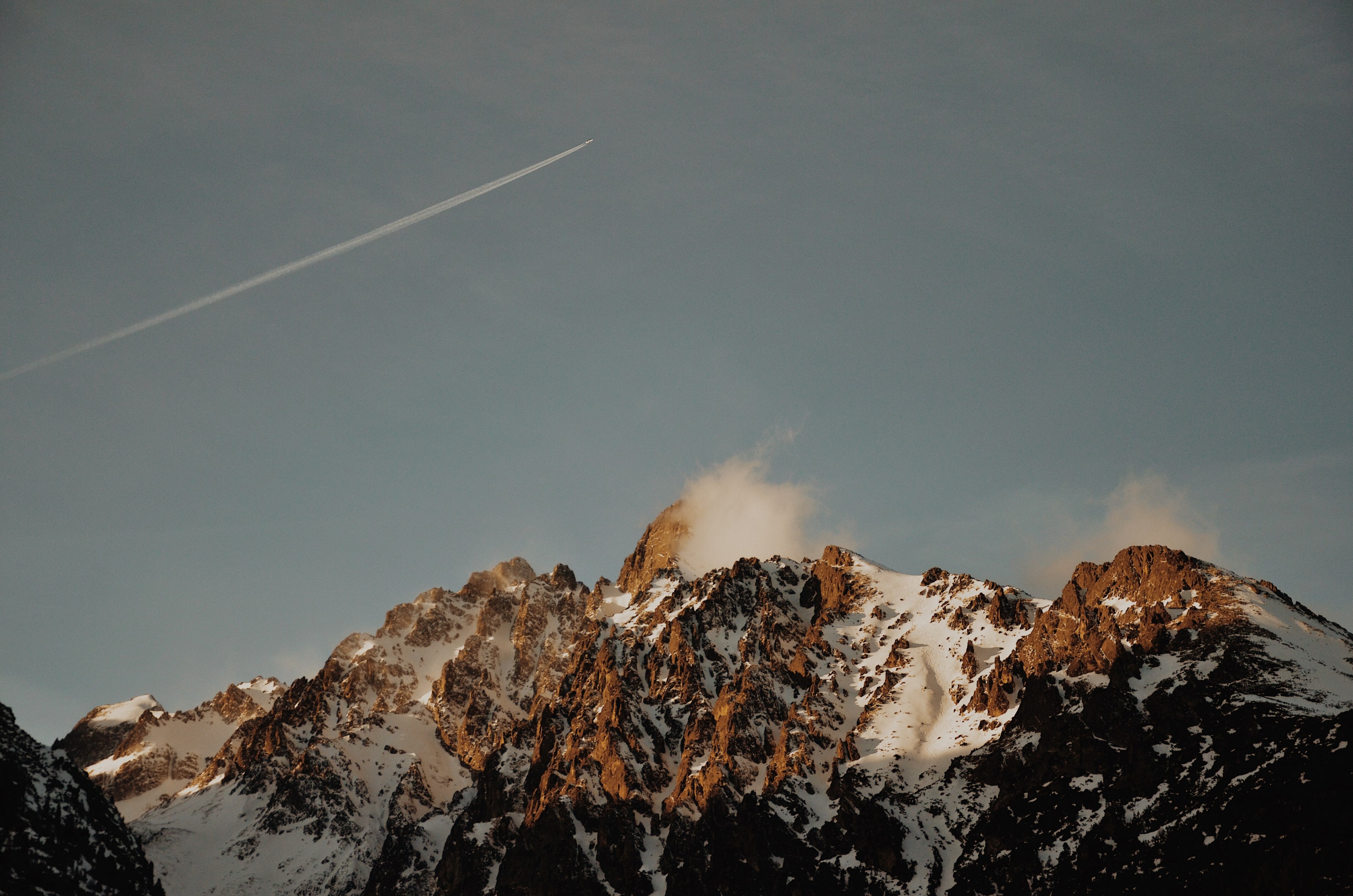a plane in the sky over snow covered mountains in the slovakian tatra mountains, windy mountain 4k, HD Wallpaper