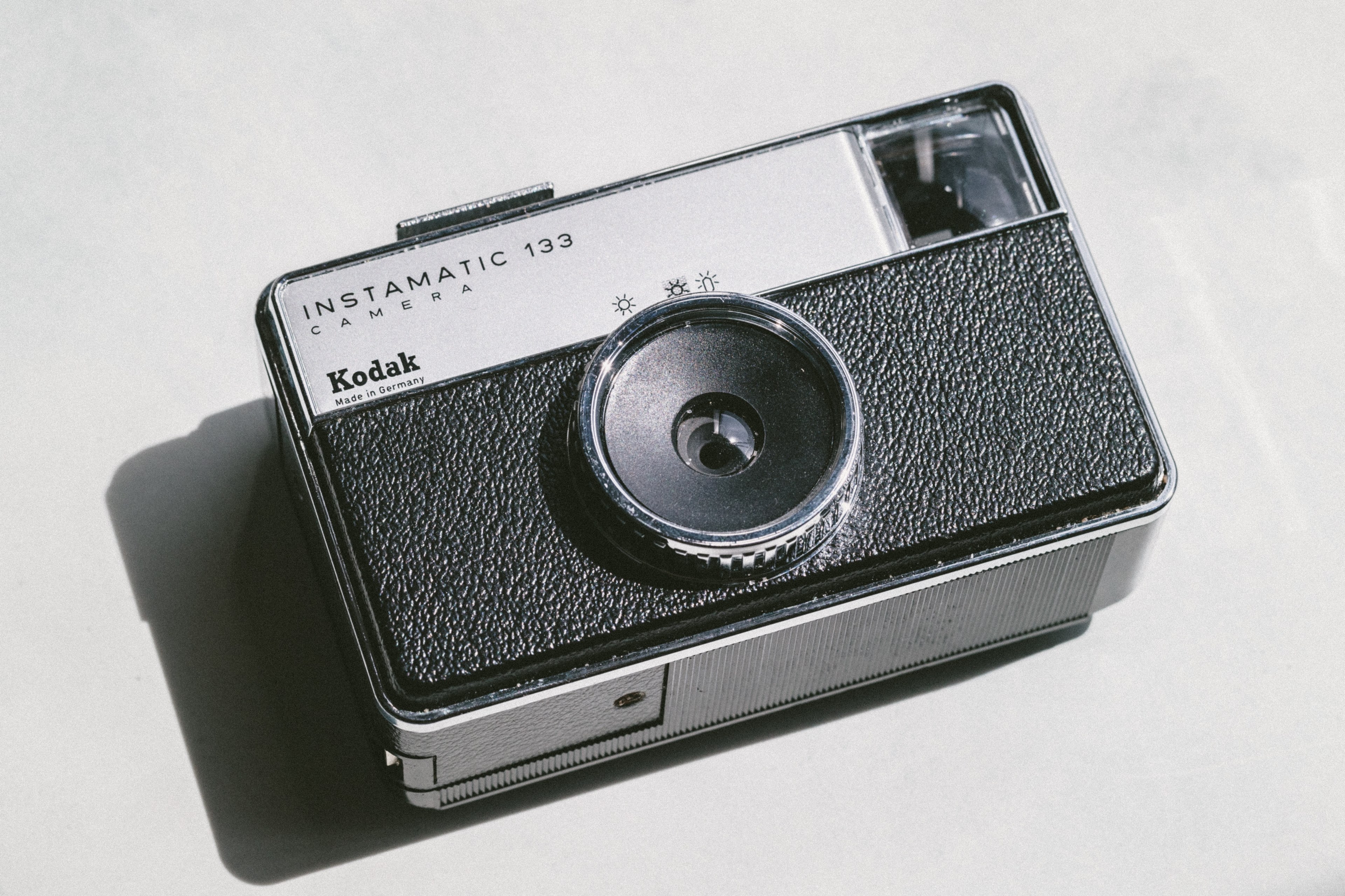 kodak instamatic 133 camera on white surface, instamatic 4k, HD Wallpaper
