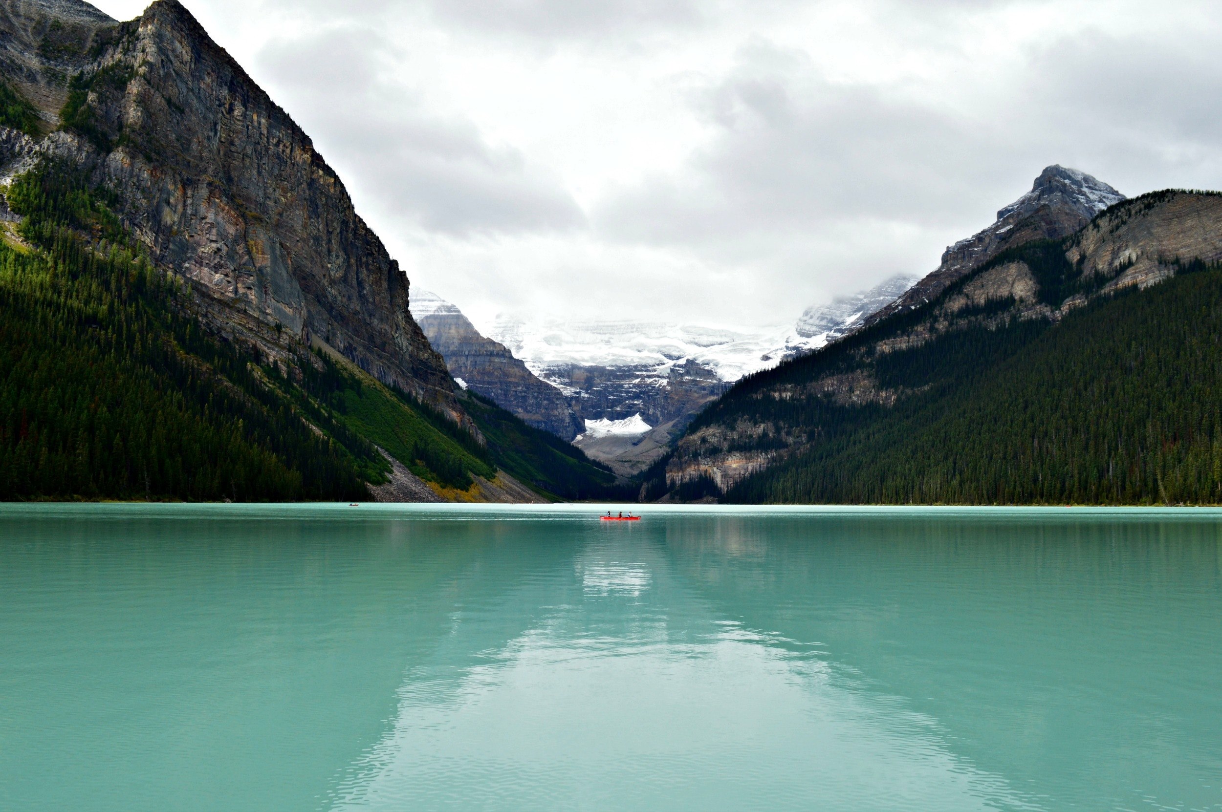 a red boat on the turquoise surface of lake louise surrounded by jagged mountains, boat on lake louise 4k, HD Wallpaper