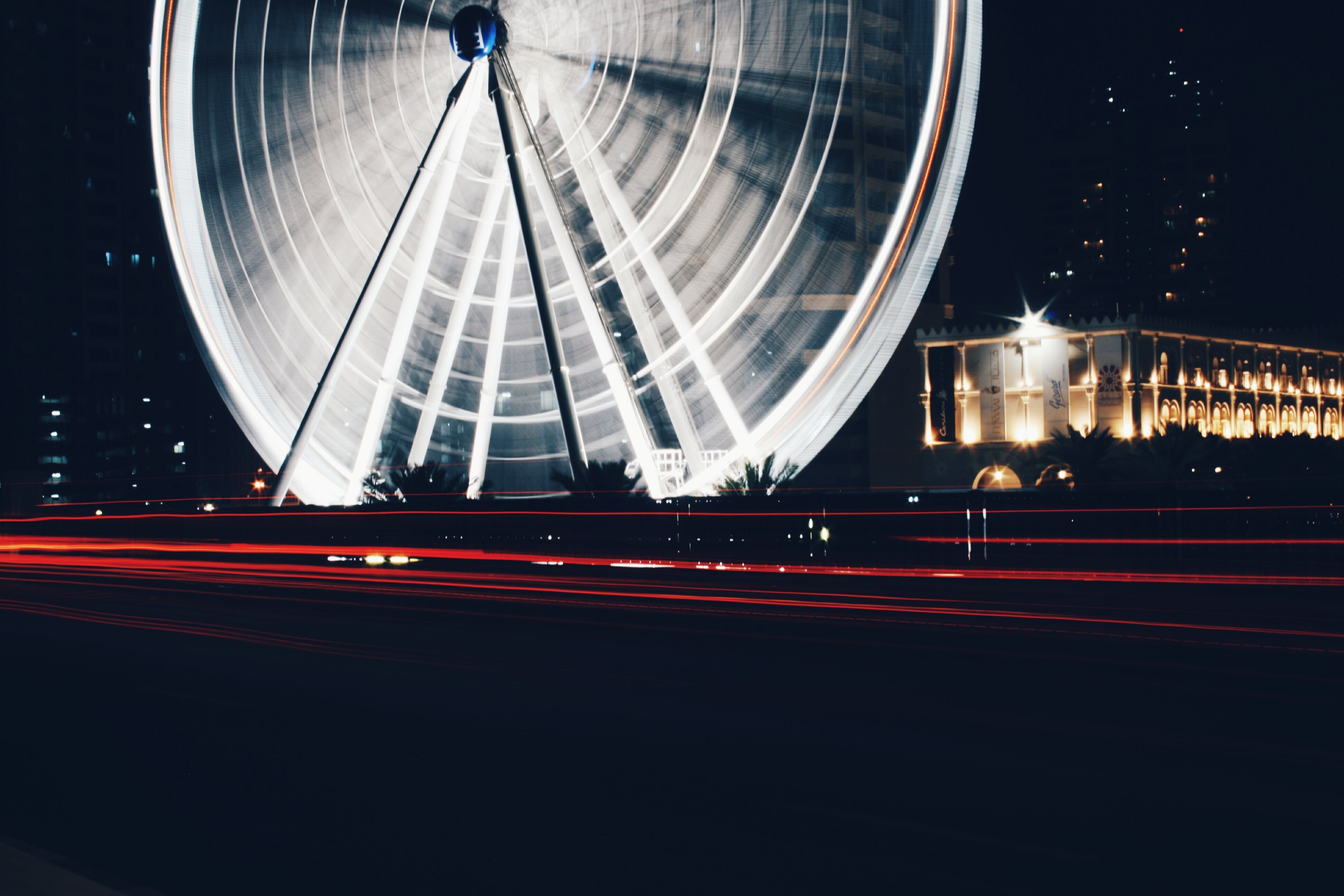 a shot up close to an illuminated ferris wheel ride in al qasba, al qasba ferris wheel at night 4k, HD Wallpaper