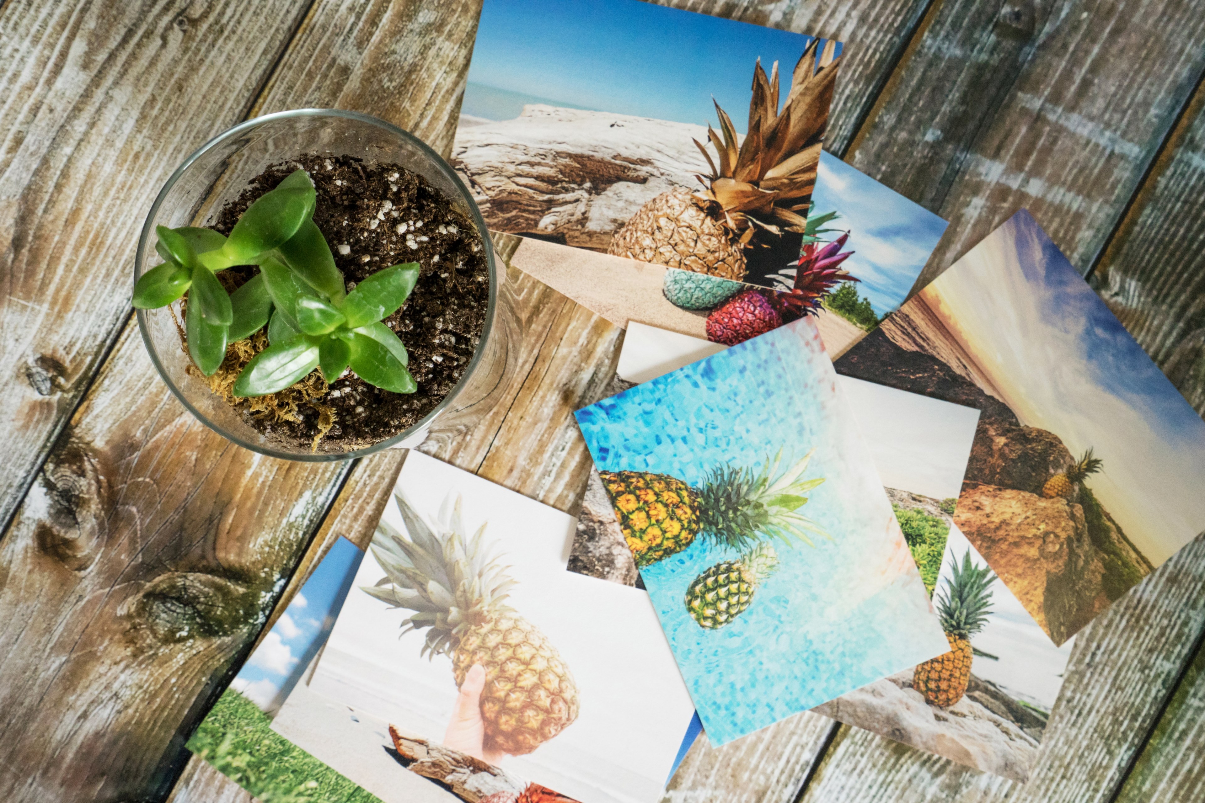 scattered photo prints on a wooden table, _pineapple postcards 4k, HD Wallpaper