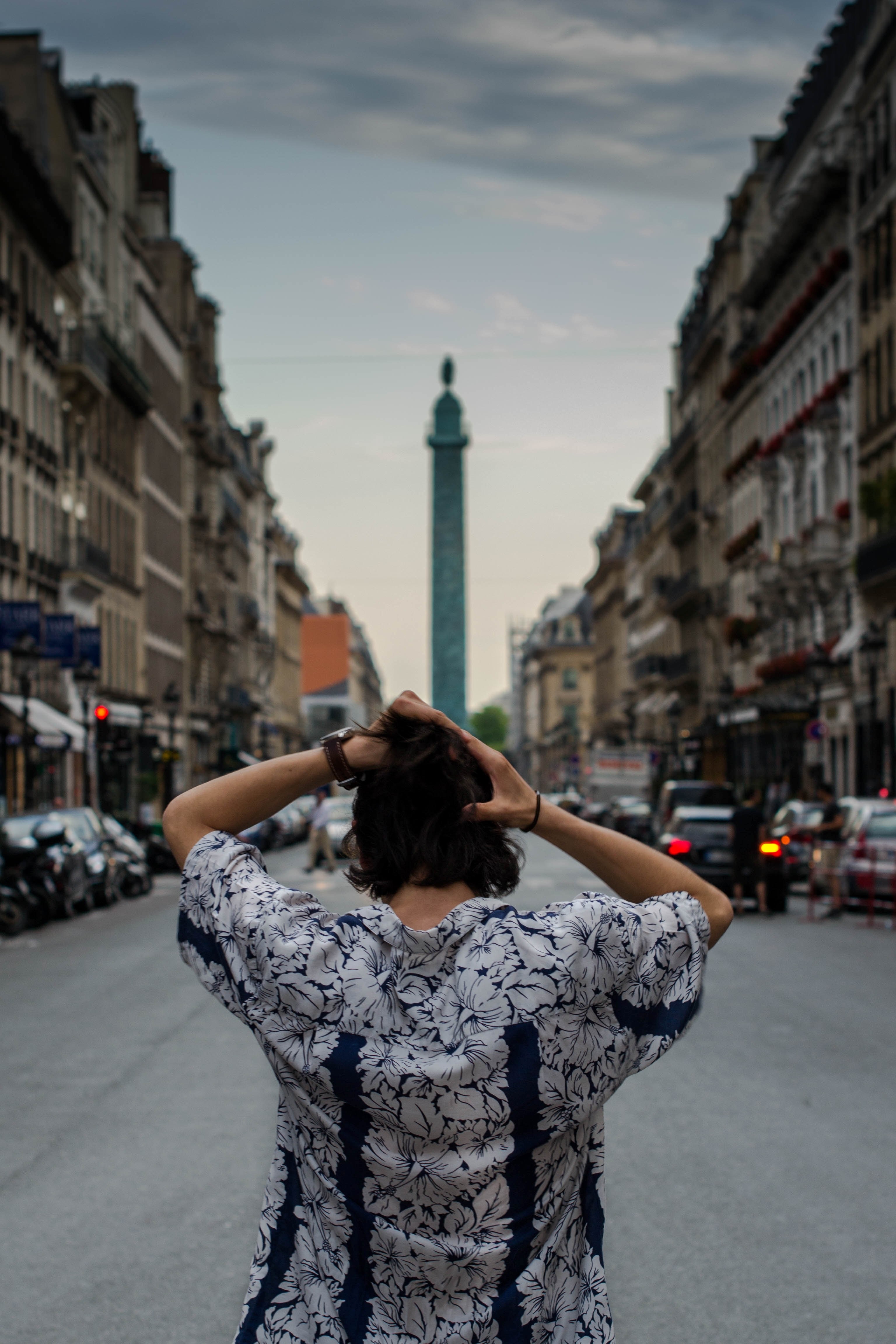 a person facing away from the camera looks down a street toward a monument in paris, person looking away in paris 4k, Phone HD Wallpaper