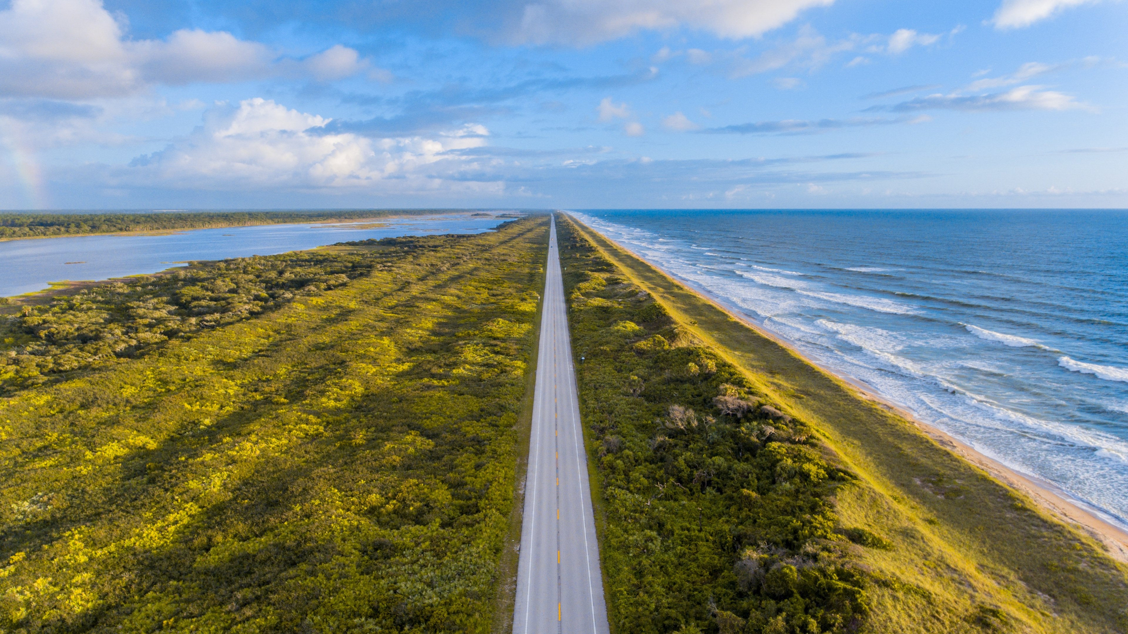 a drone shot of a long road along the seashore, long seaside road 4k, HD Wallpaper