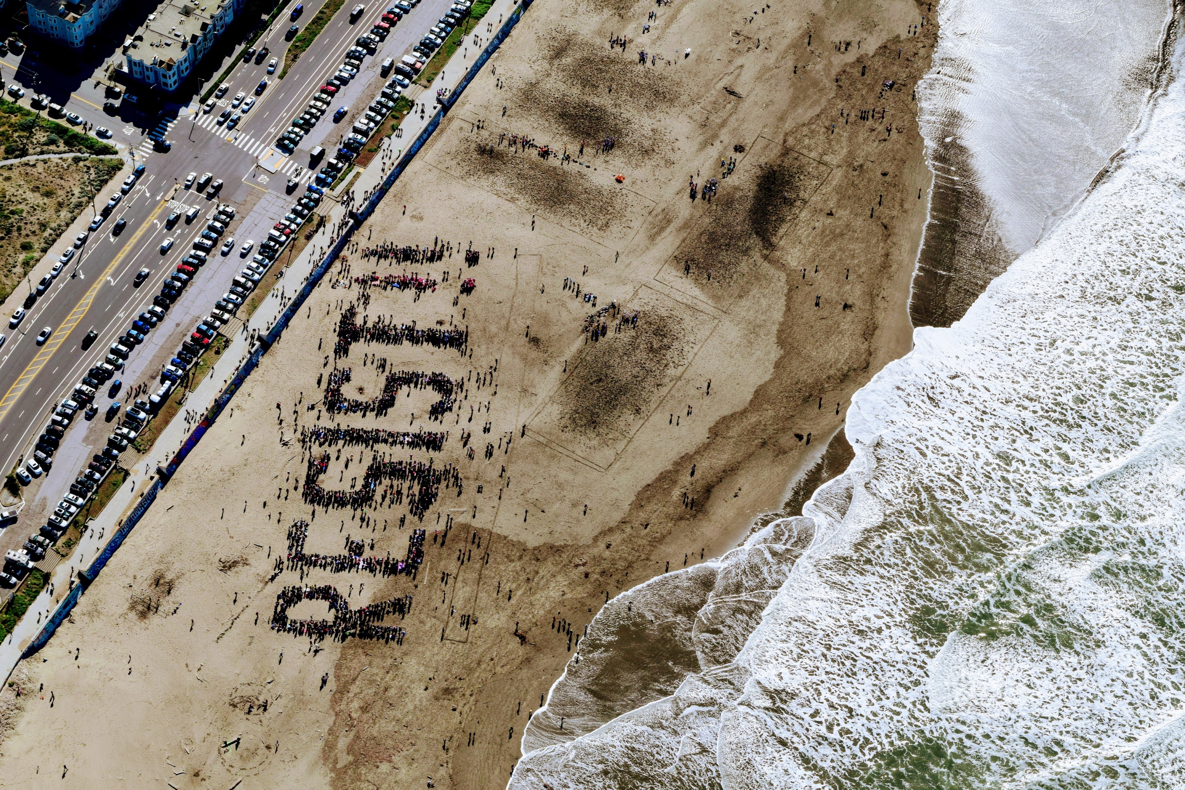 drone view of resist protest on the sand of ocean beach, _resist on san francisco beach 4k, HD Wallpaper