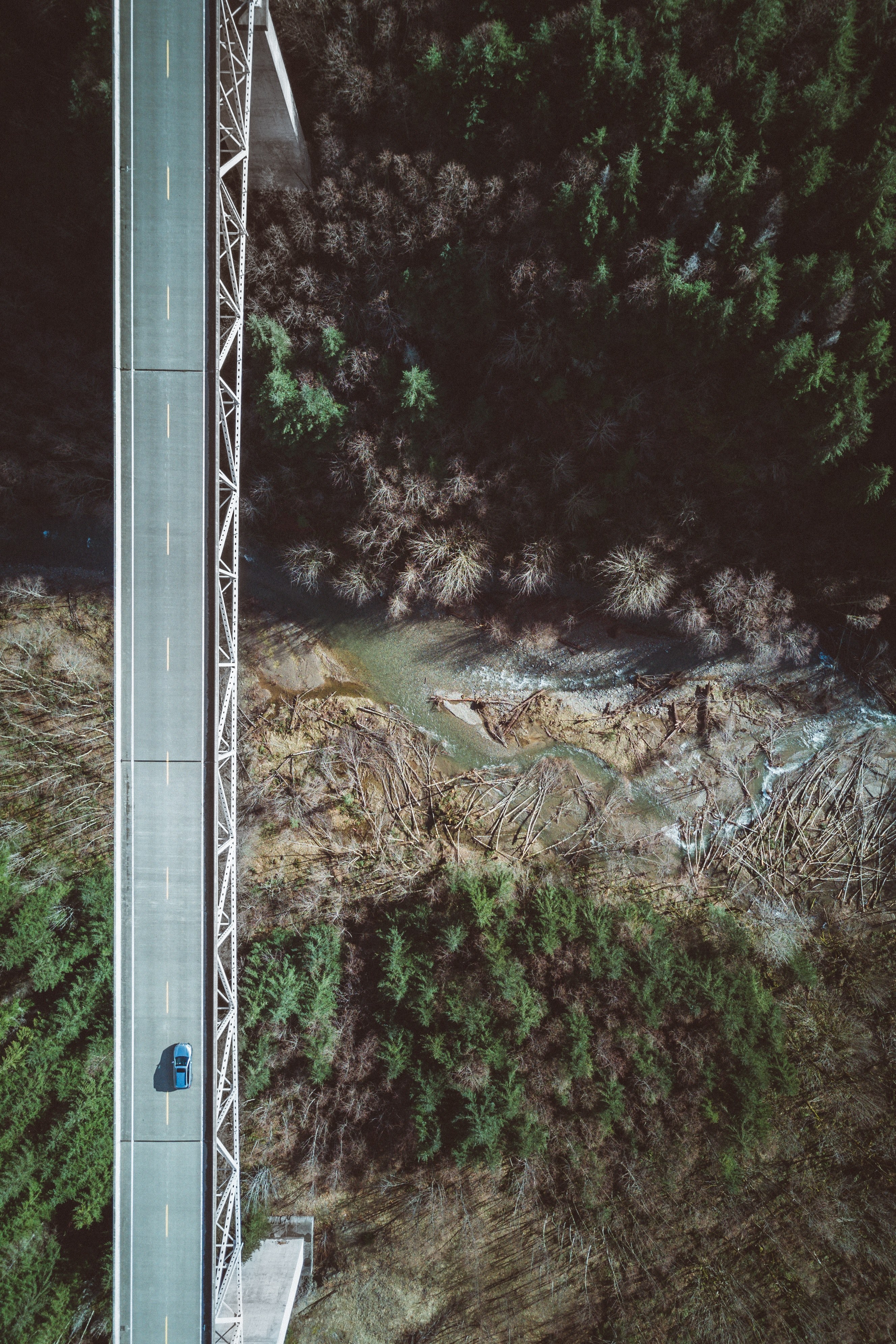 a drone shot of a car on a bridge over a deep ravine with a river, from above 4k, Phone HD Wallpaper