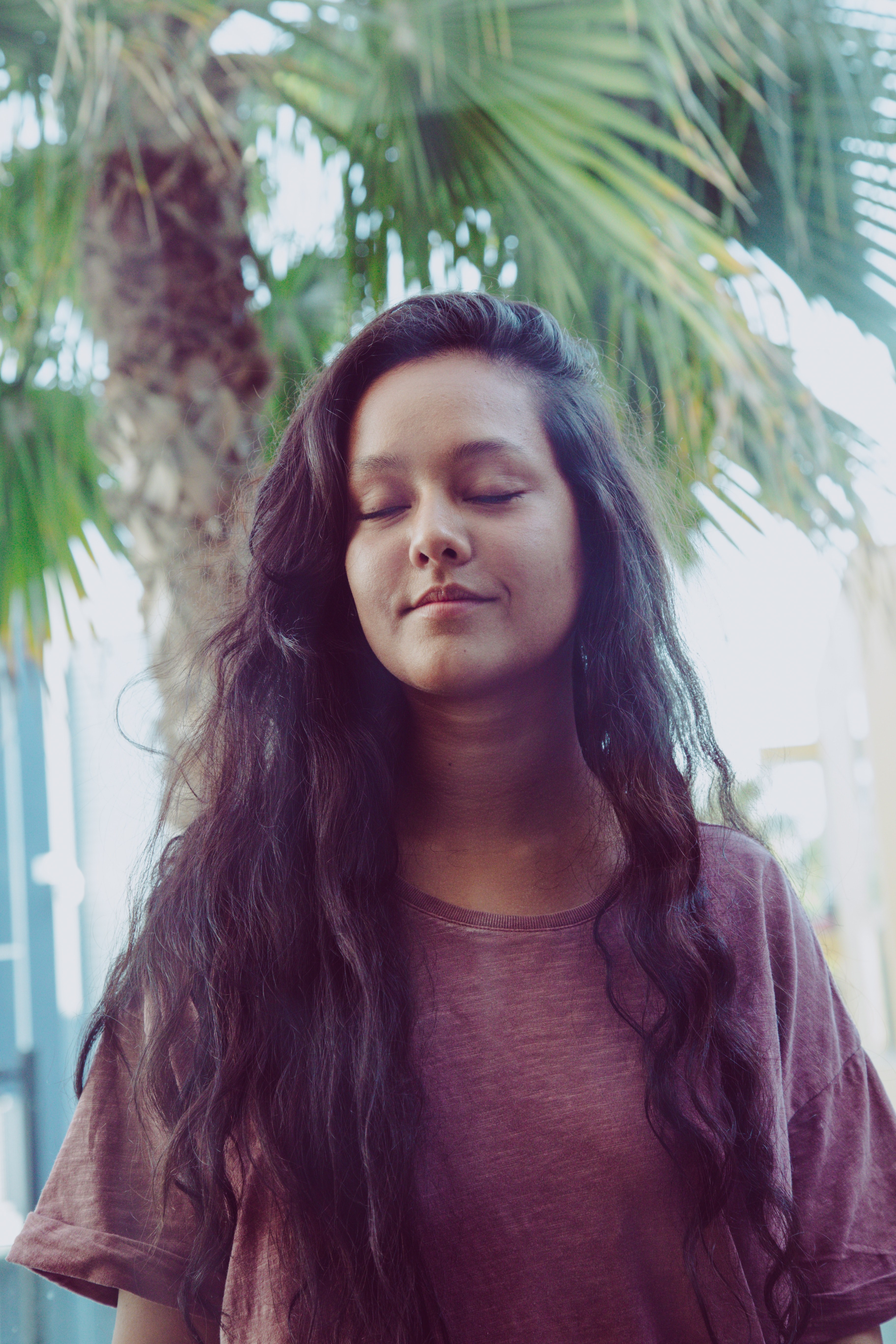 happy woman peacefully closing her eyes near a palm tree, sleep baby 4k, Phone HD Wallpaper