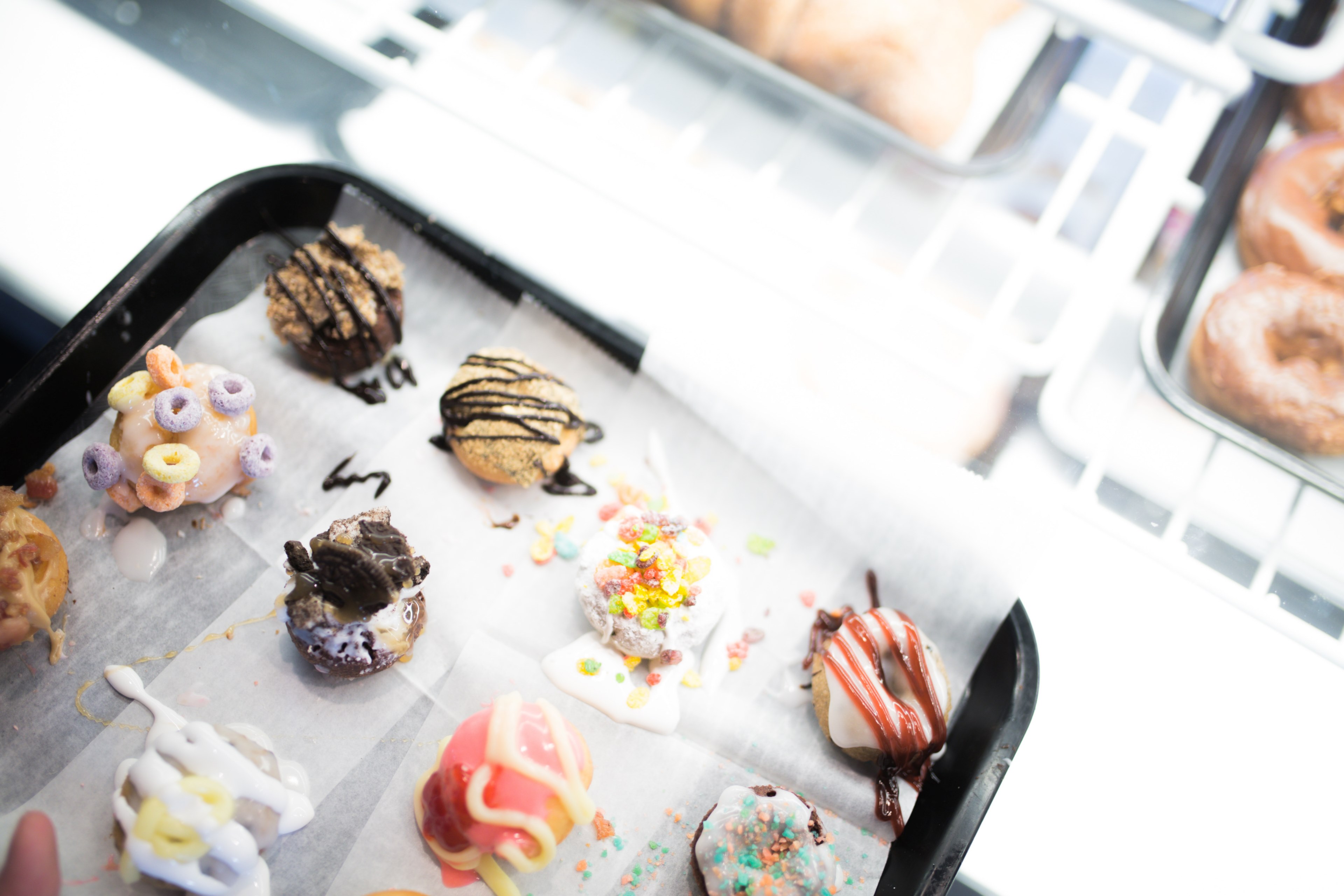 unique pastry truffles with cereal and chocolate drizzles in a bakery, trendy bakery foods 4k, HD Wallpaper