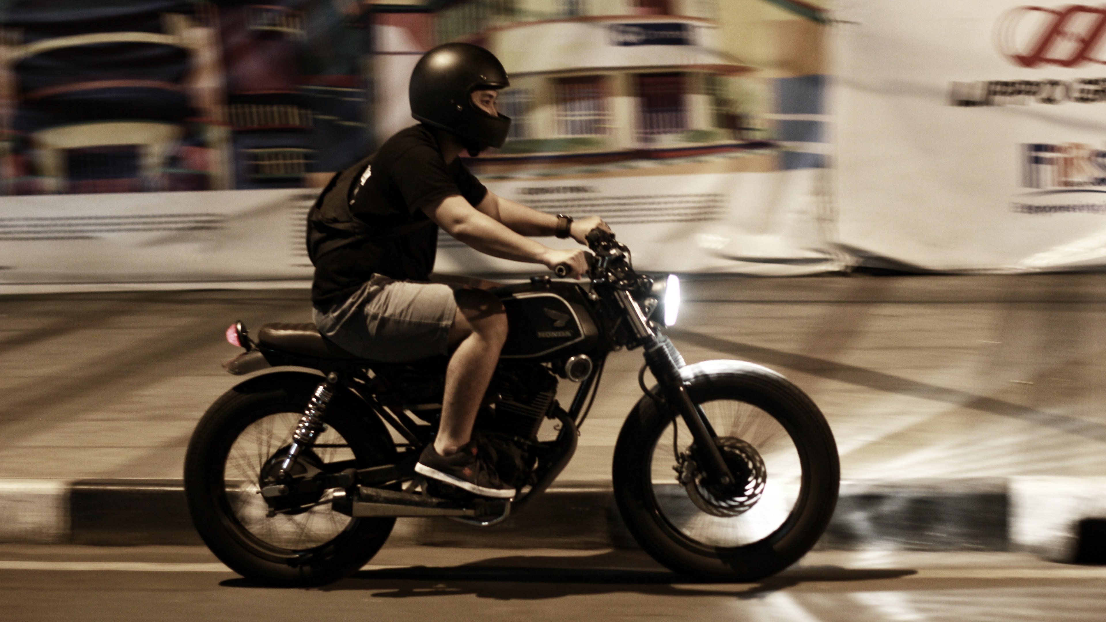 a man in a black helmet on a motorbike in artificial light, riding a motorbike in the evening 4k, HD Wallpaper