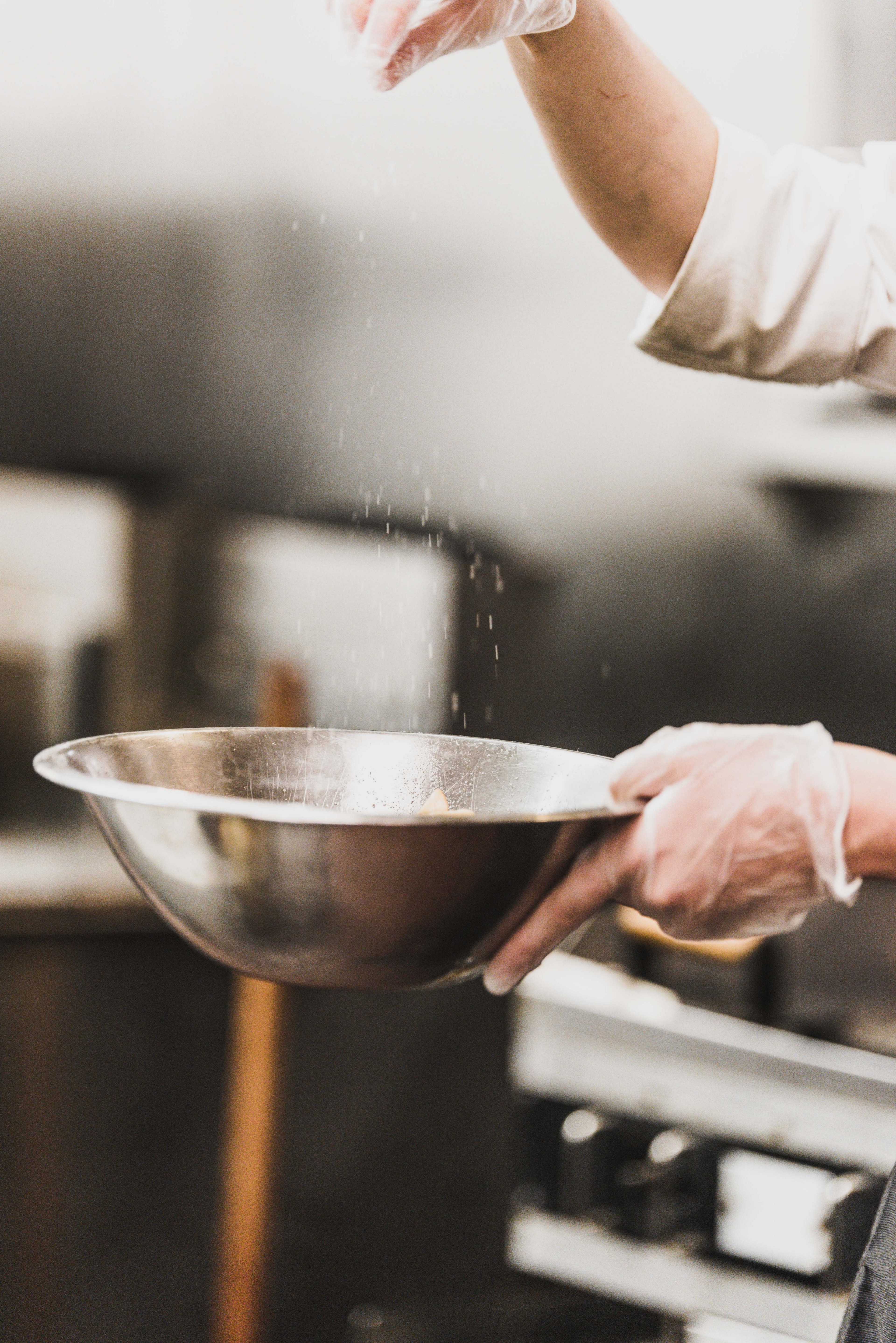 a cook wearing gloves seasoning food in a silver bowl, seasoning food 4k, Phone HD Wallpaper