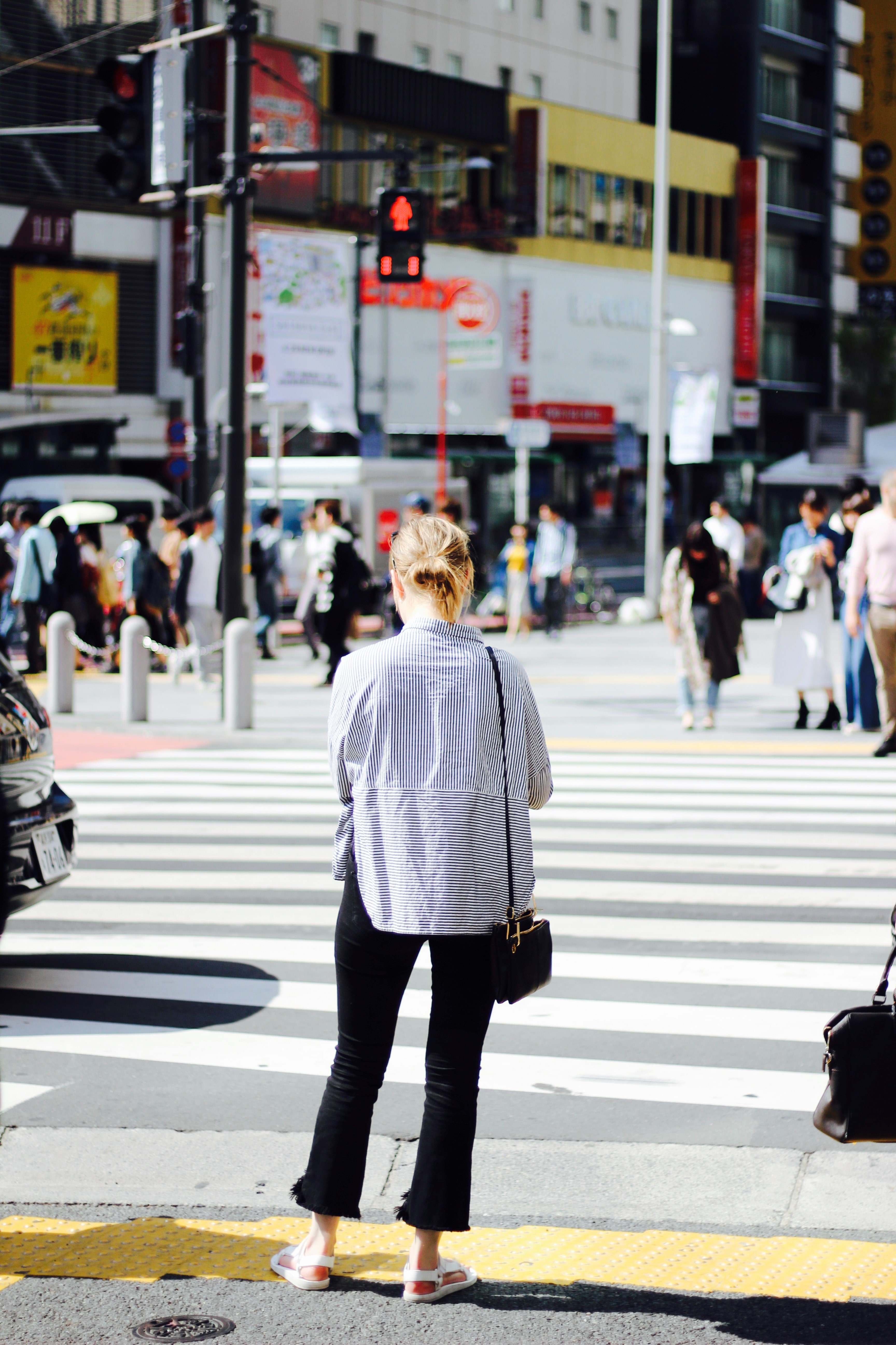 a woman is waiting at the crosswalk for the lights to turn green in shibuya, _lost in translation 4k, Phone HD Wallpaper