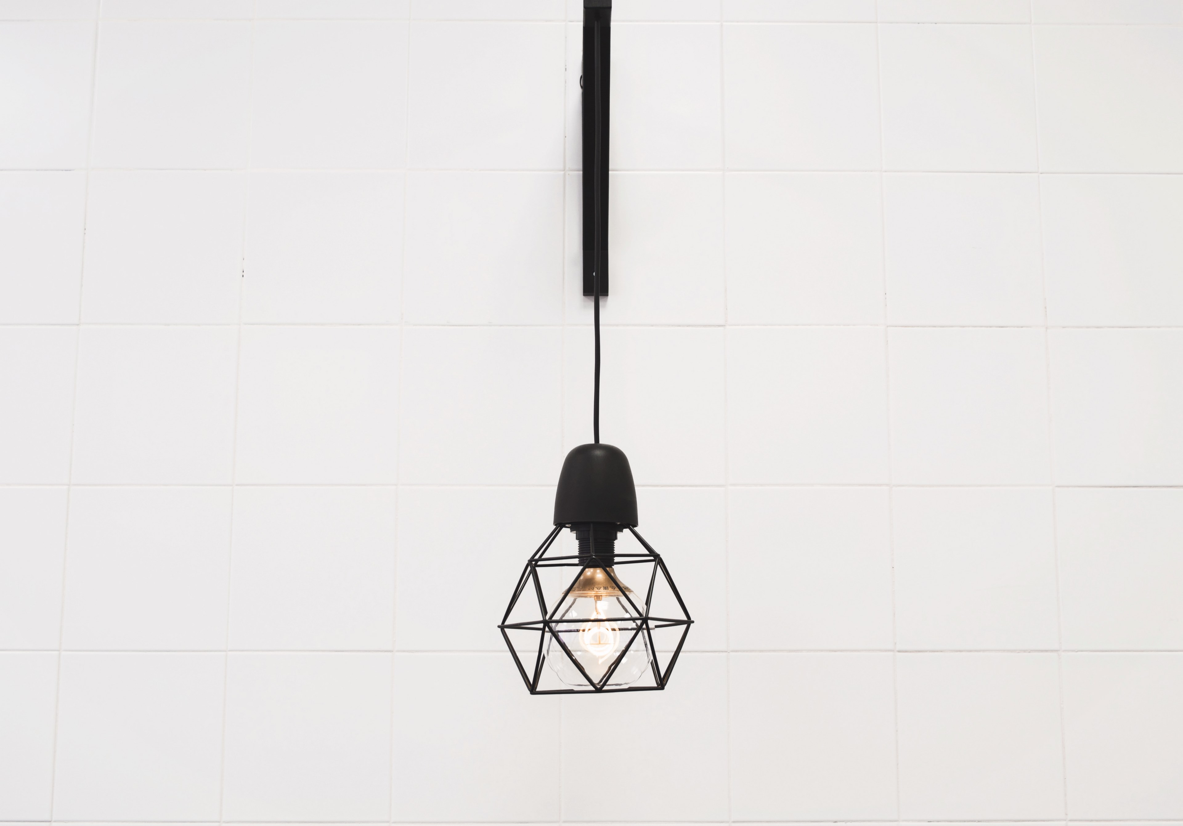 single geometric lantern with light bulb hanging on a white wall, geometric decor 4k, HD Wallpaper