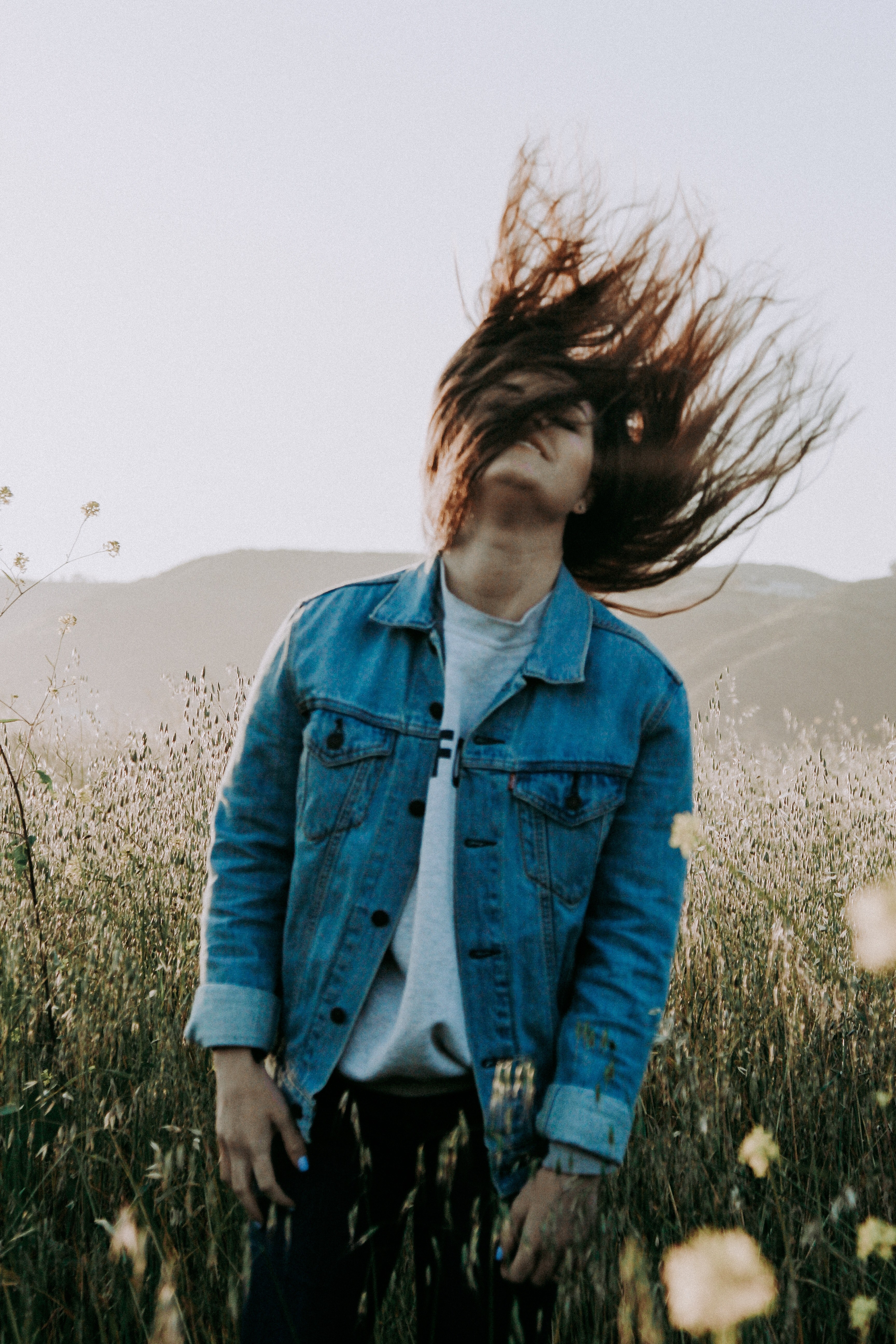 happy woman flipper her hair and standing in a wildflower field, freedom 4k, Phone HD Wallpaper
