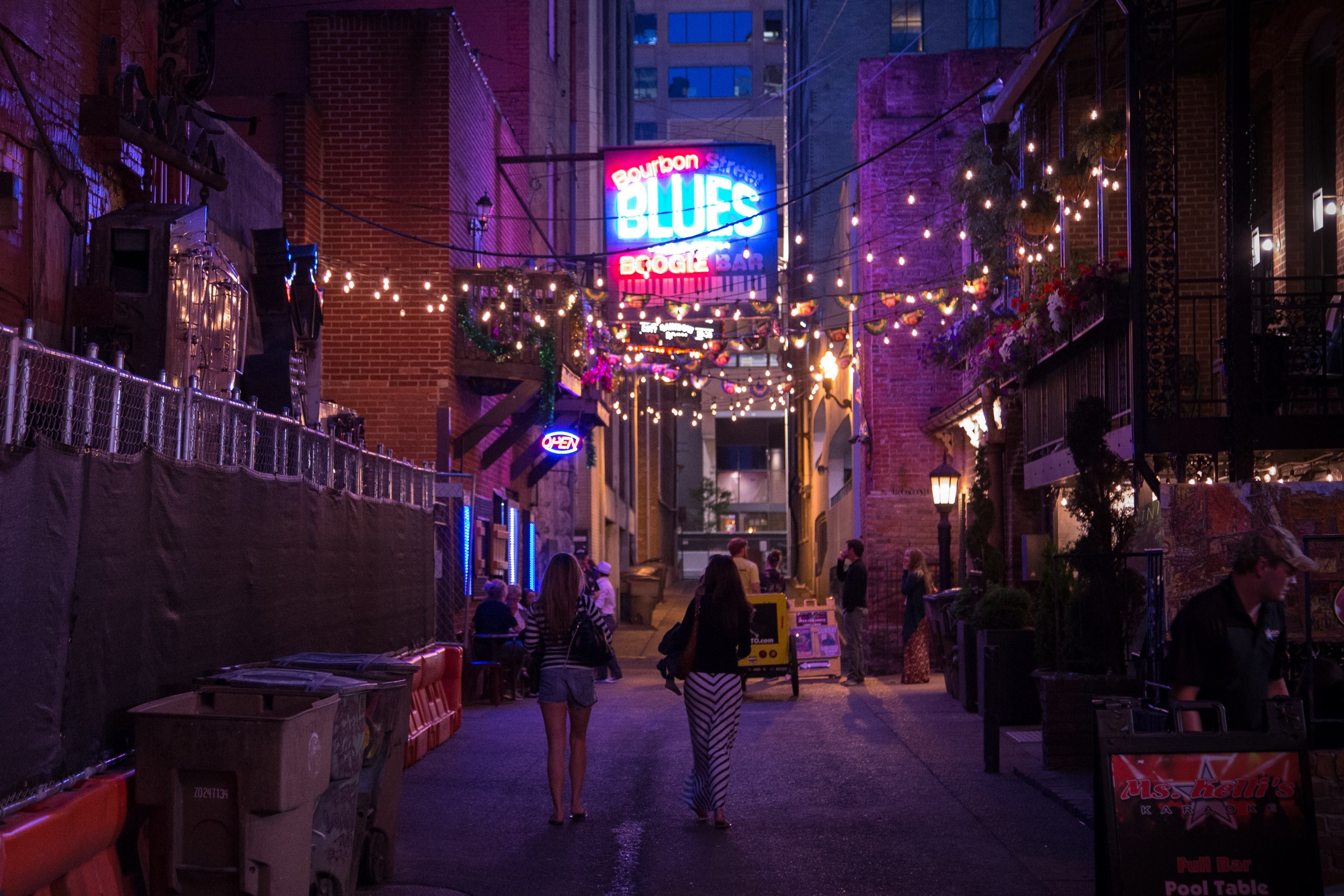 people walking through a downtown street under a line of lights, _printers alley 4k, HD Wallpaper