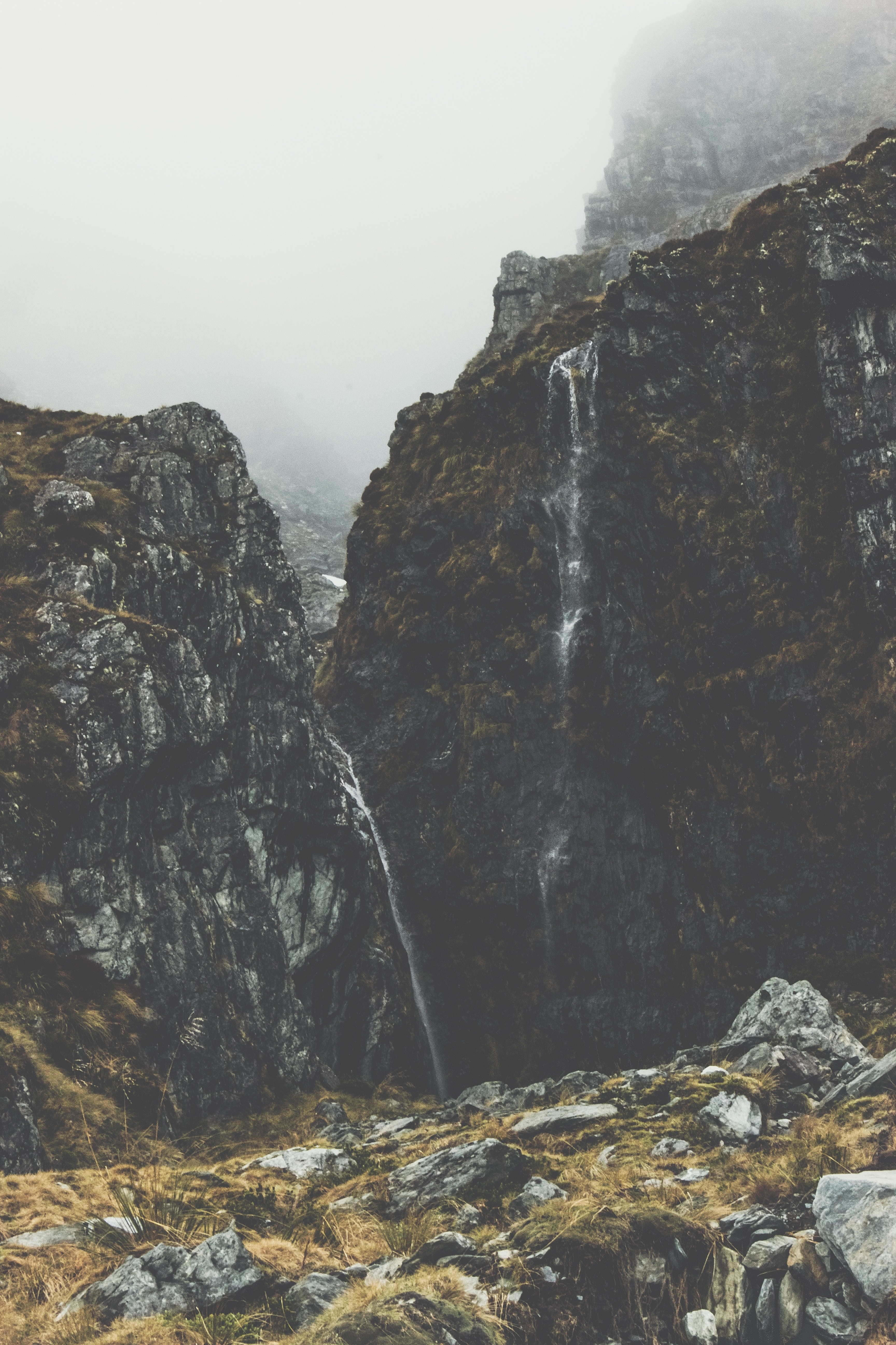 waterfall on a scenic mountainside on a misty morning in mount aspiring national park, waterfall in a national park 4k, Phone HD Wallpaper