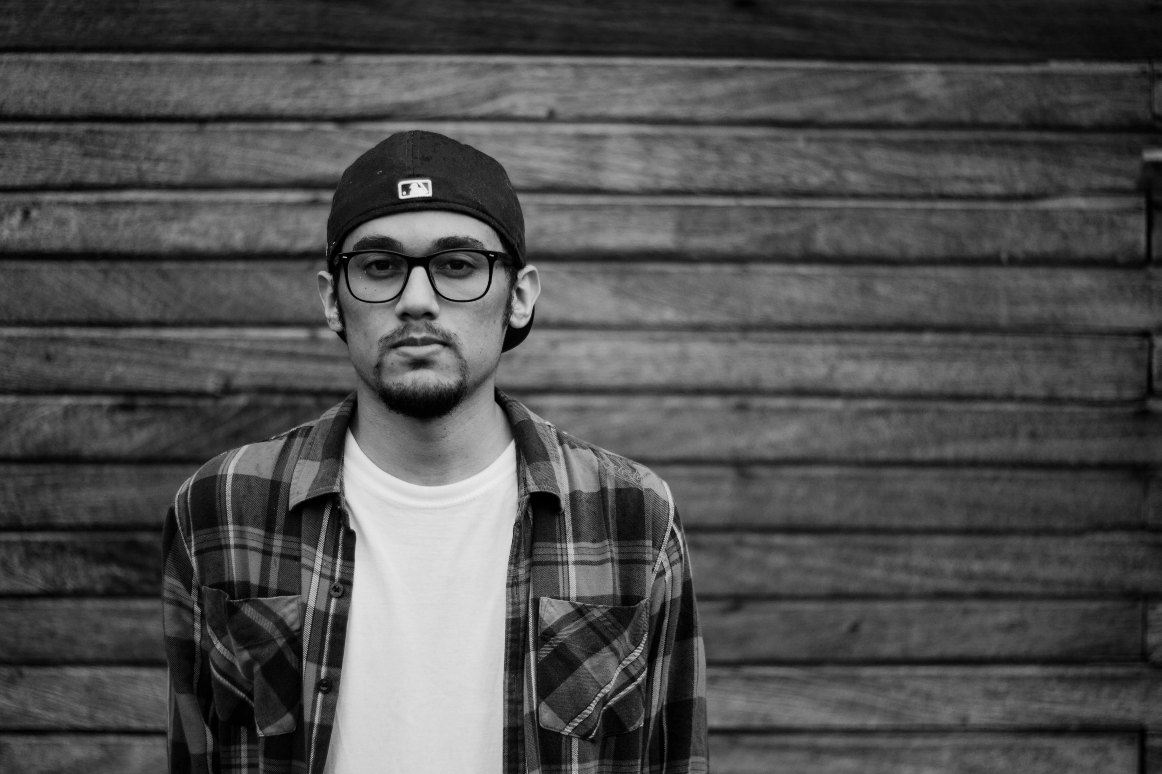 a man with a goatee and glasses in a plaid shirt in barinas, _monochrome plaid shirt man 4k, HD Wallpaper