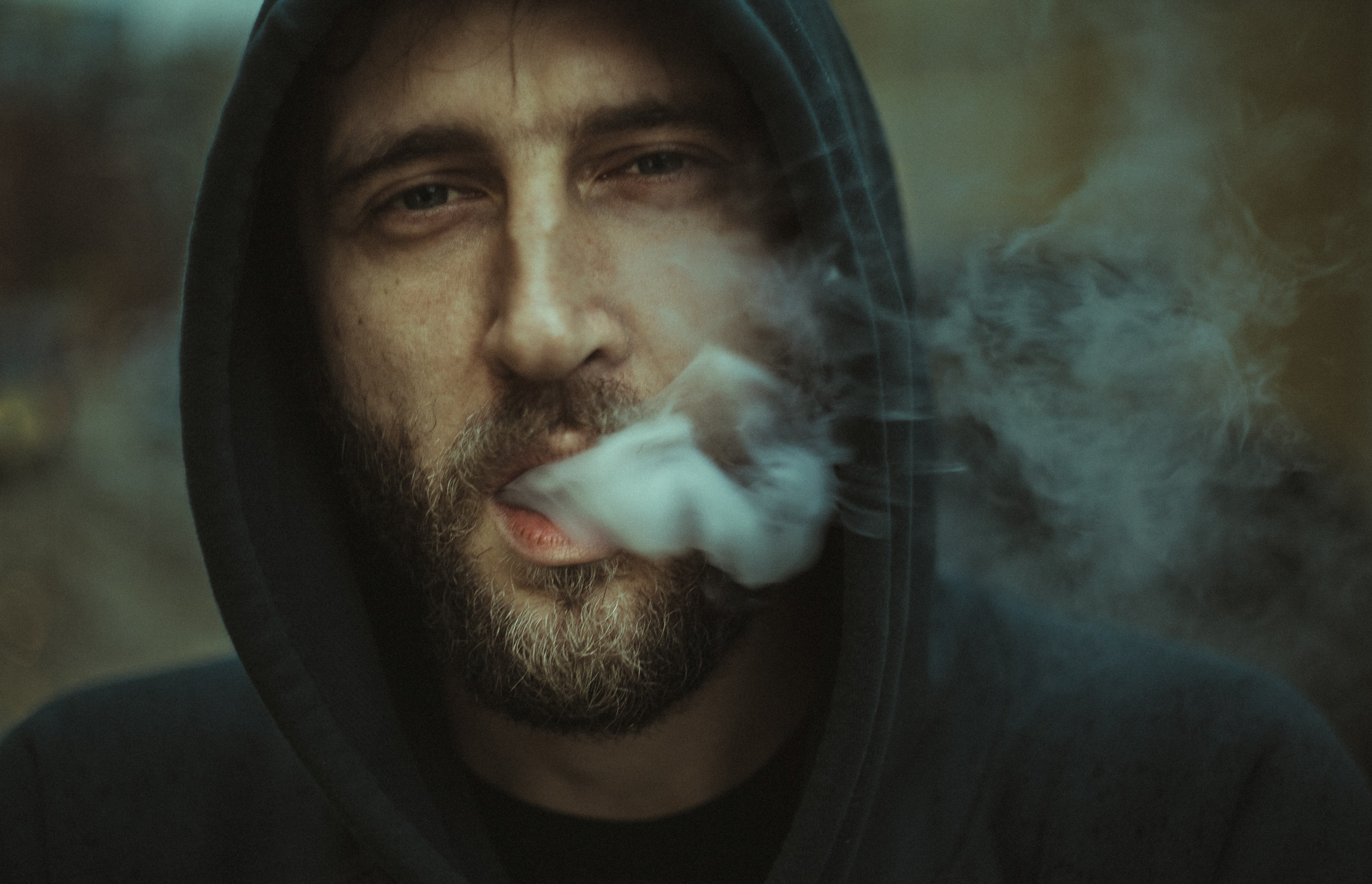 man in a hoodie exhaling smoke from his mouth, smoky exhale 4k, HD Wallpaper