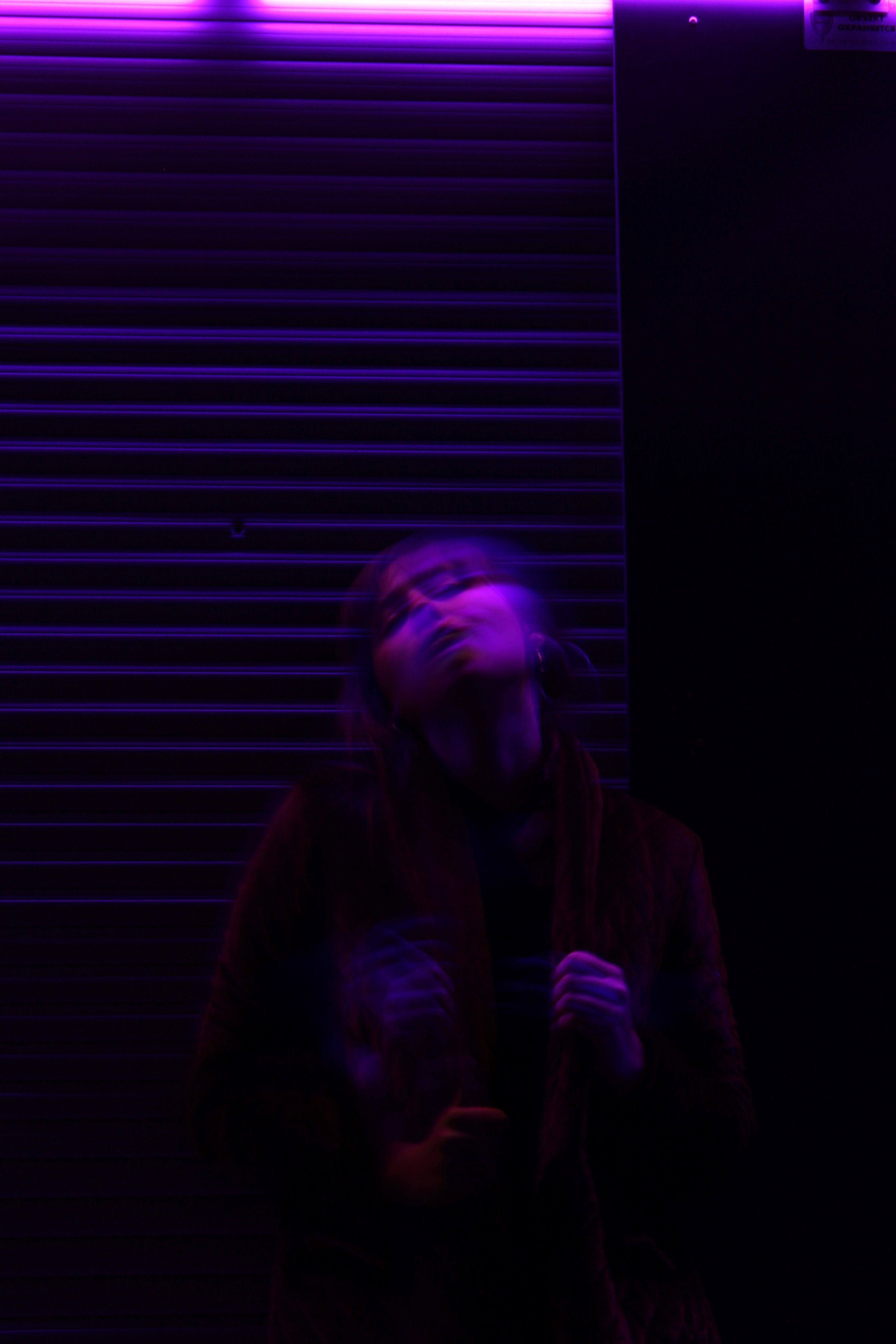 a motion blur shot of a young woman under purple lighting in kaliningrad, _motion blur woman kaliningrad 4k, Phone HD Wallpaper