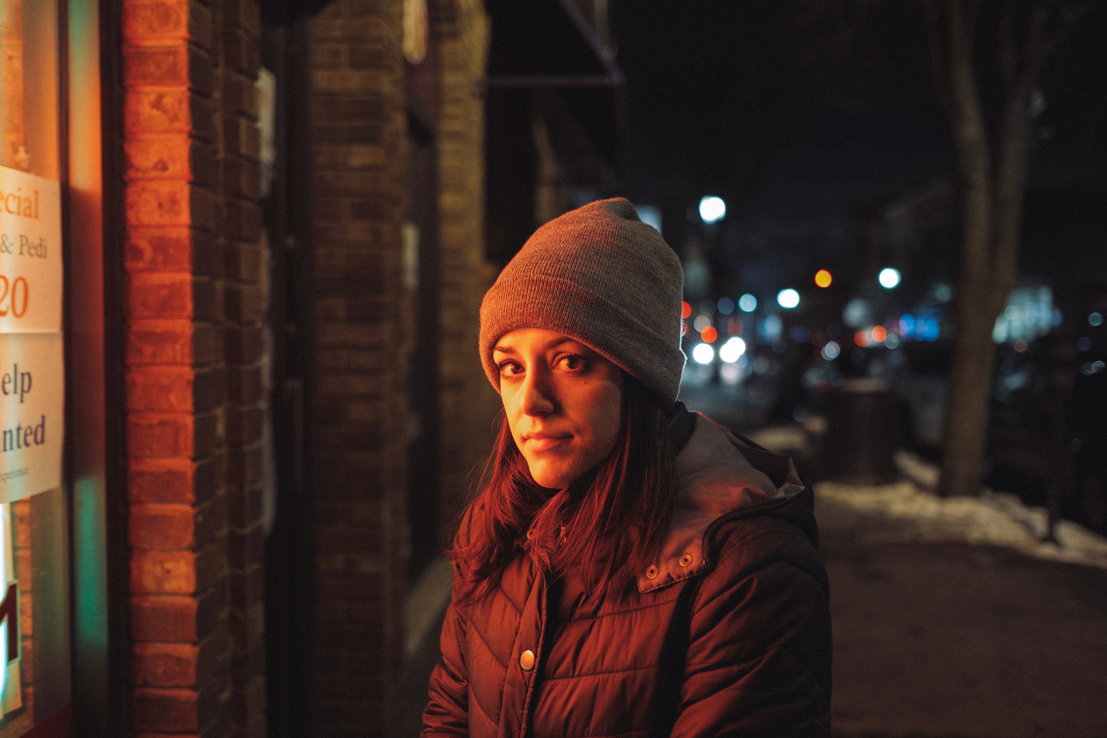 a woman in a knit cap and coat stands on a snowy sidewalk in bayonne, the perfect portrait 4k, HD Wallpaper