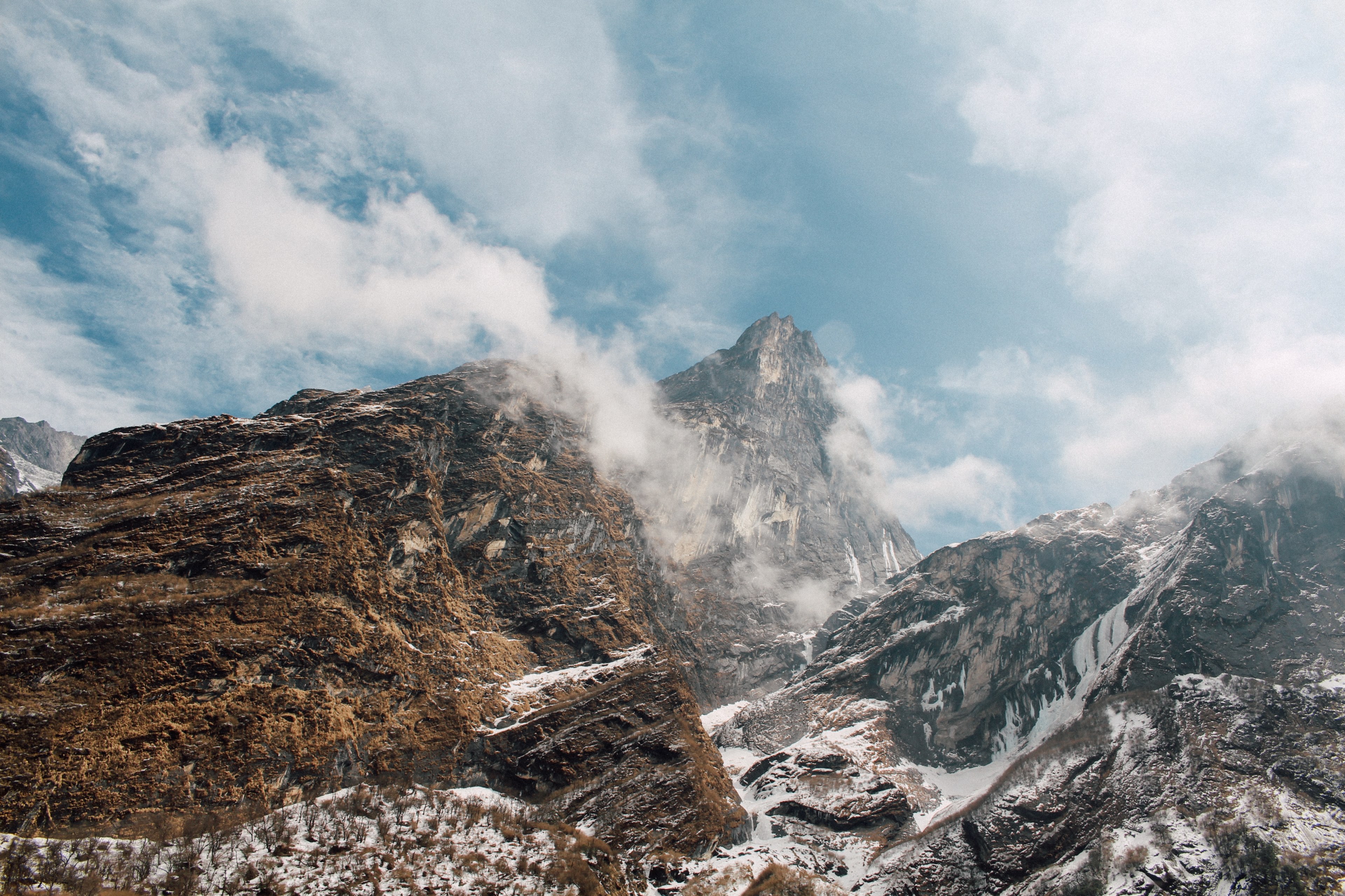 a high mountain top towering over two other peaks under a cloudy sky, three mountain peaks 4k, HD Wallpaper