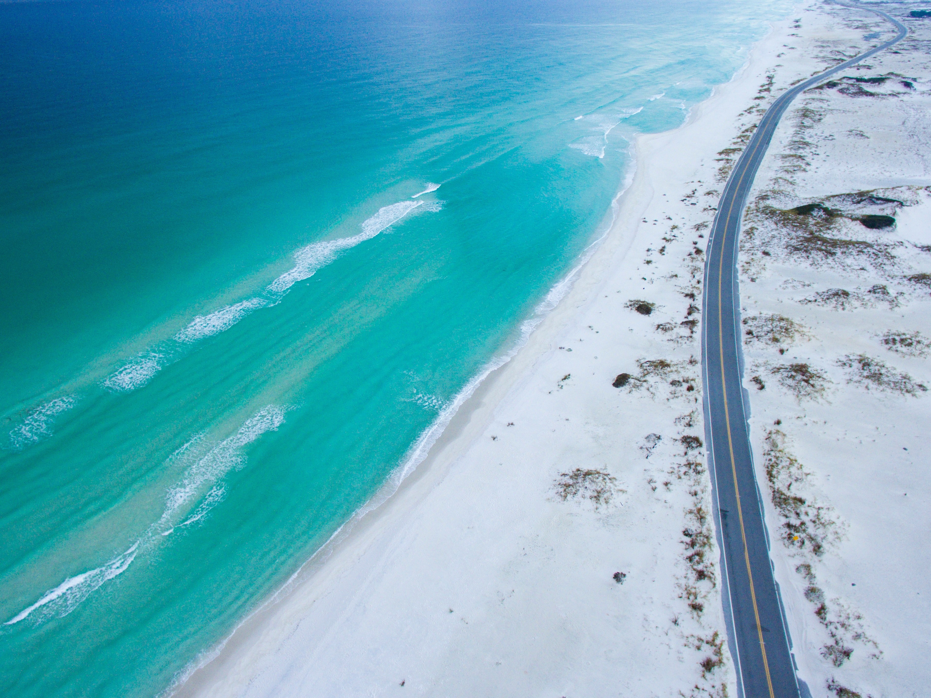 drone view of a road along the sand beach coastline at gulf breeze florida united states, dream drive 4k, HD Wallpaper