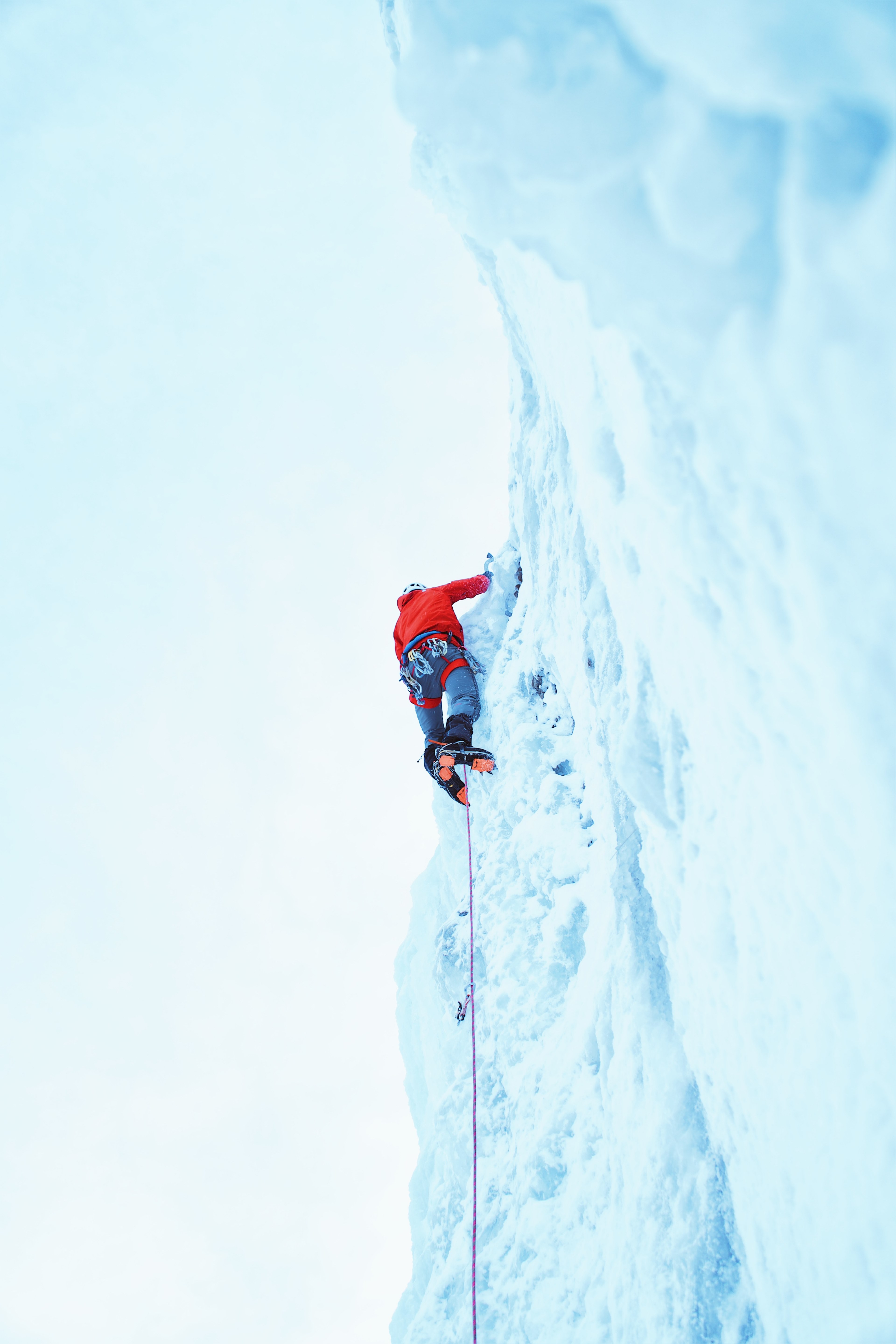 a person wearing a red shirt ice climbing attached to a rope at bridal veil falls, bridal veil falls ice climber 4k, Phone HD Wallpaper