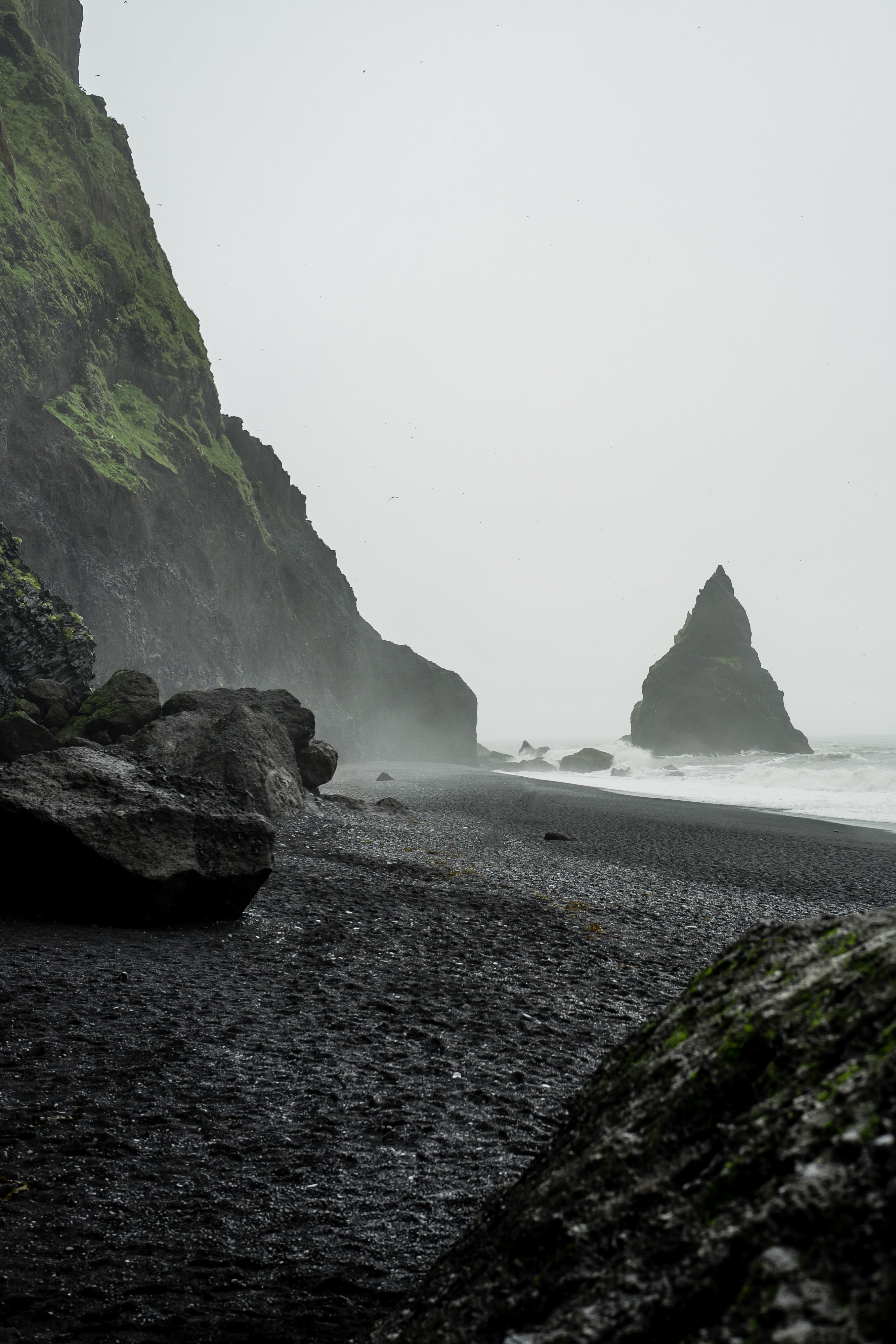 rough ocean washing on the rocky black sand shore, shore 4k, Phone HD Wallpaper