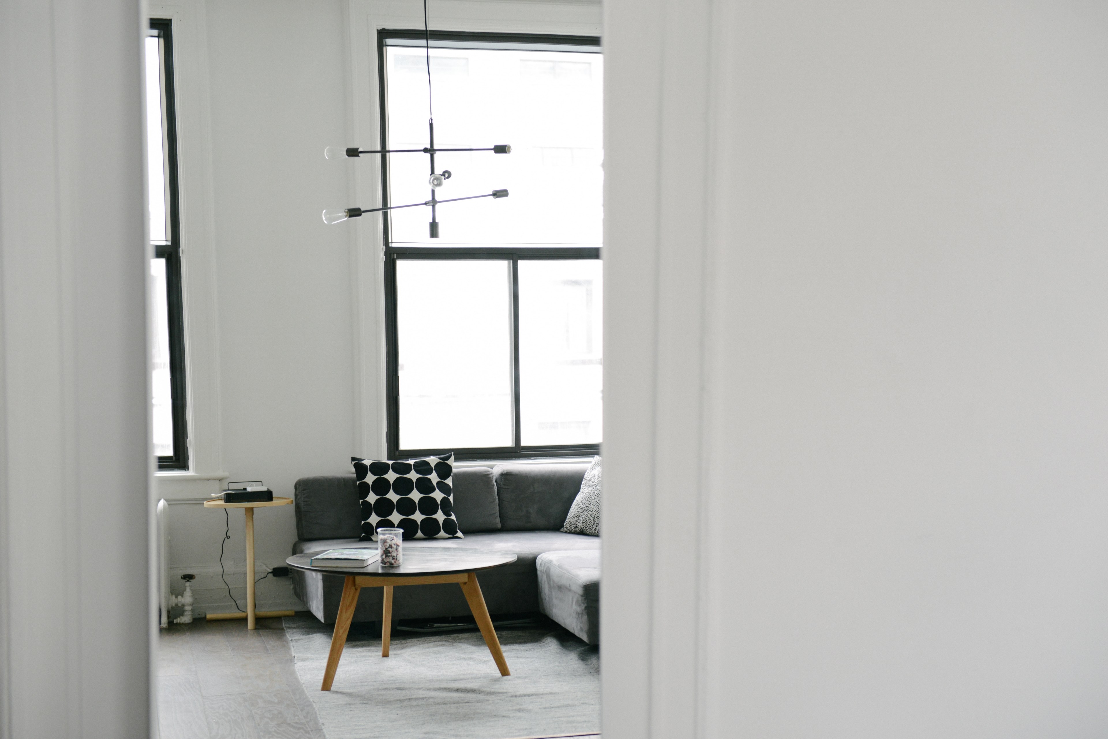 a cozy interior with large windows and a coffee table next to a sofa, cozy interior with a sofa 4k, HD Wallpaper