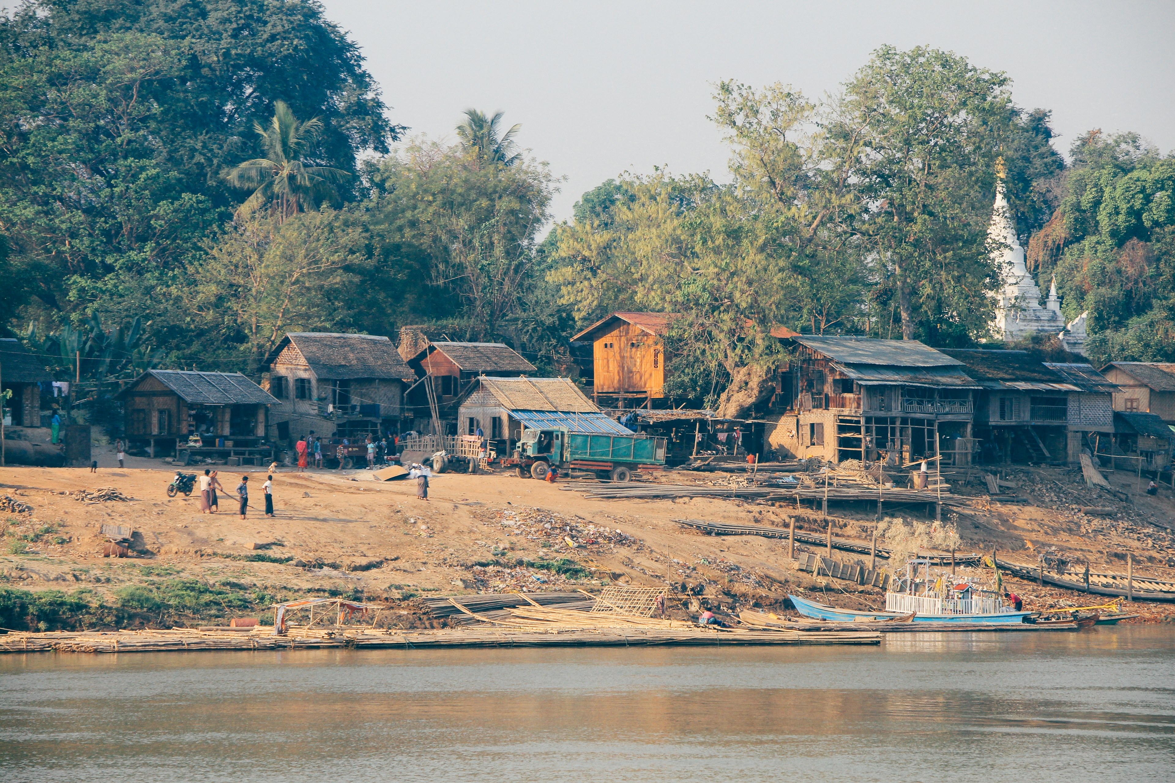 a small village with wooden houses trees few people and a river next to it in old began, _to bagan in myanmar 4k, HD Wallpaper